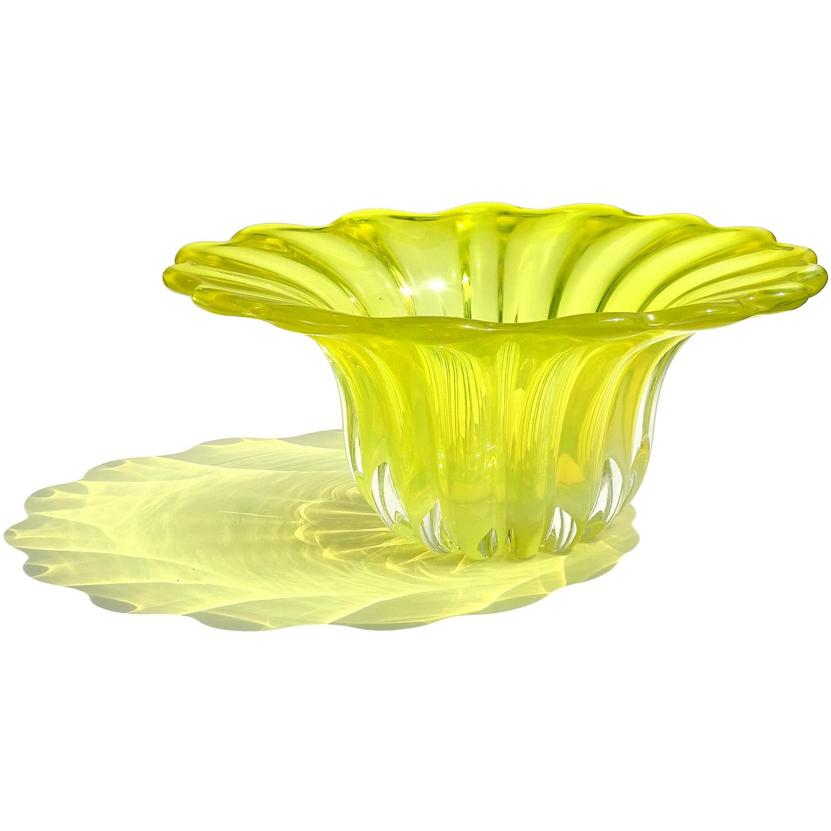 Beautiful large vintage Murano hand blown Sommerso bright yellow and opalescent Italian art glass centerpiece bowl / vase. Created in the manner of designer Alfredo Barbini. It has a ribbed body with flared out scalloped rim. In a darker background,