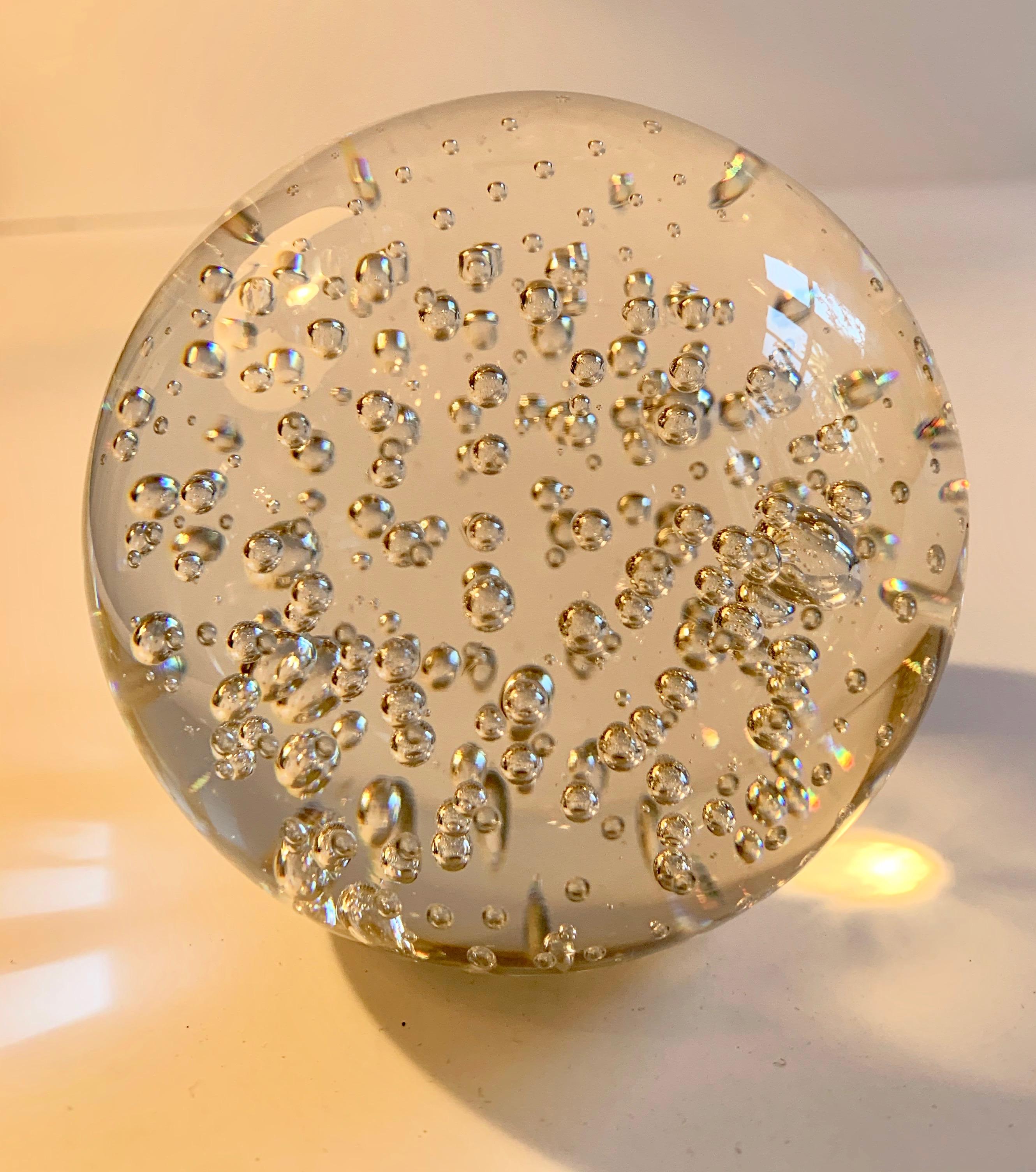 A wonderful decorative piece or paper weight... a very nice clear glass with bubbles.