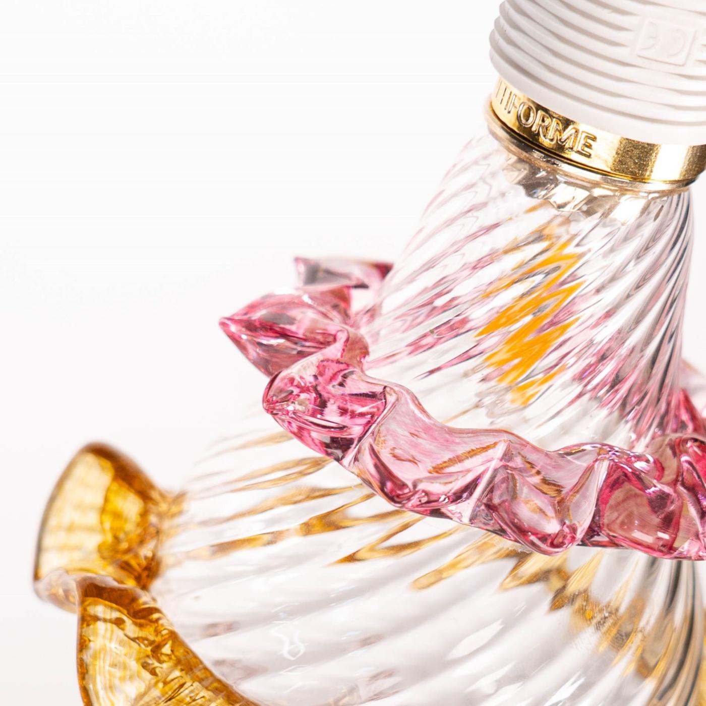 Blown glass body worked in rigamenà is decorated with evocative and original colours and shapes from the Murano craft tradition. A rostral decoration in ruby glass and amber ballerina surrounds the central body. The final raindrop is in clear