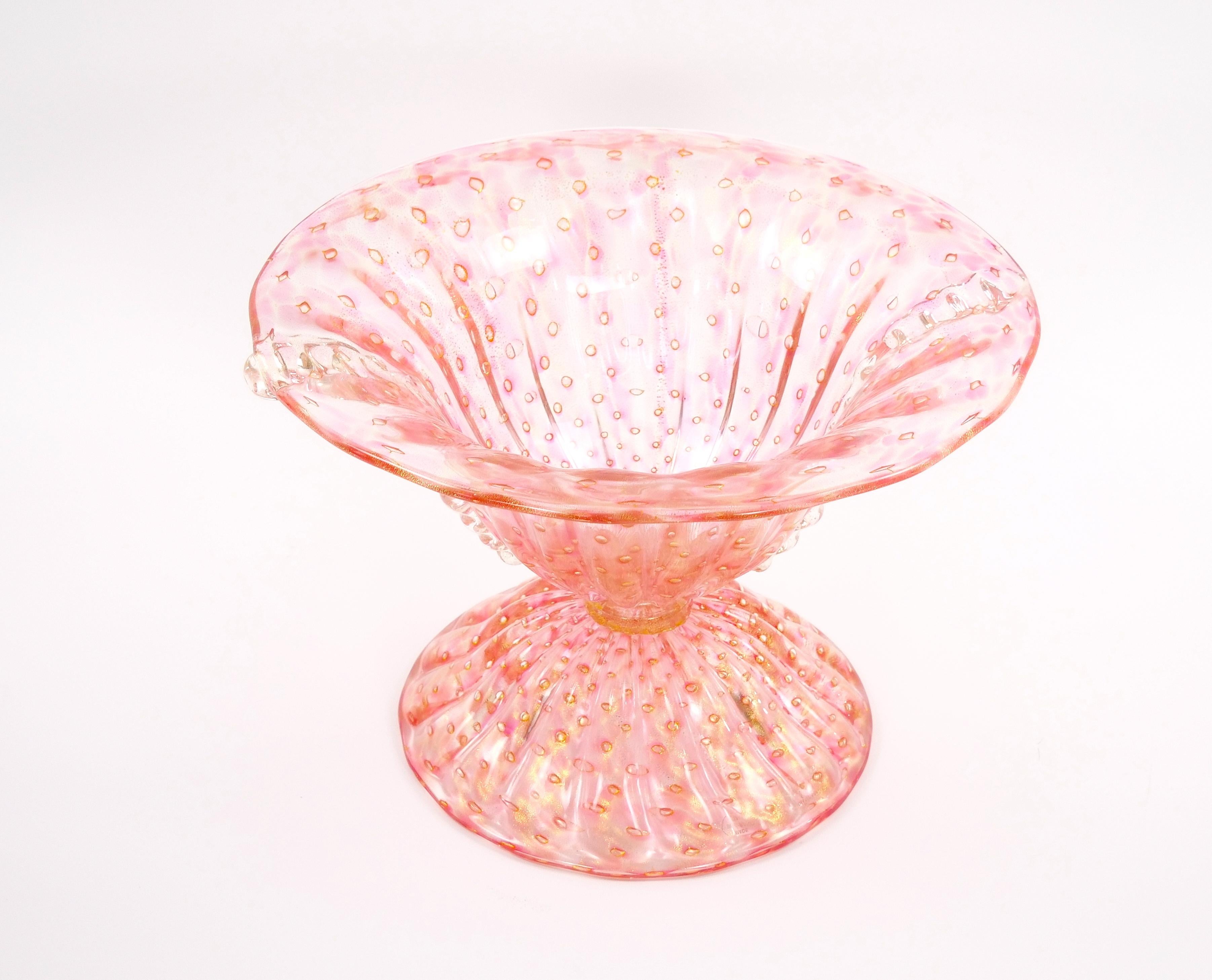 Elevate your table decor with this exquisite and large Murano  Handcrafted and Mouth-Blown Bullicante / Gold Infused Rose-Colored Glass Centerpiece Bowl. This masterful work of art is a testament to the rich tradition of Murano glassmaking and