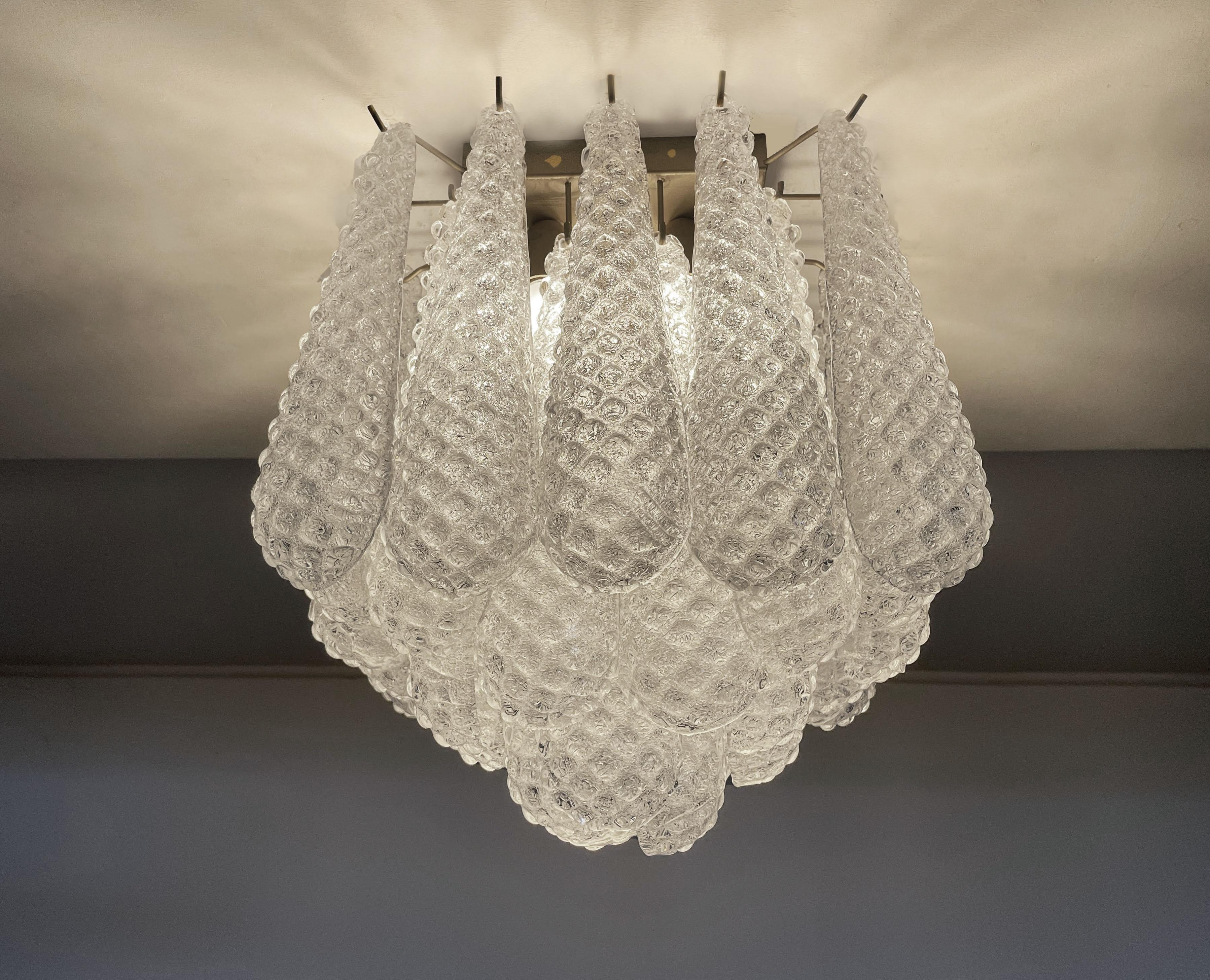 Spectacular ceiling lamp with 32 Murano Glasses in golden painted metal frame.  Elegant lighting object.
Period:	late xx century
Dimensions: 7,45 inchs (45 cm) height; 13,55 inches (35 cm) depth; 13,55 inches (35 cm) depth.
Dimension glasses: 12