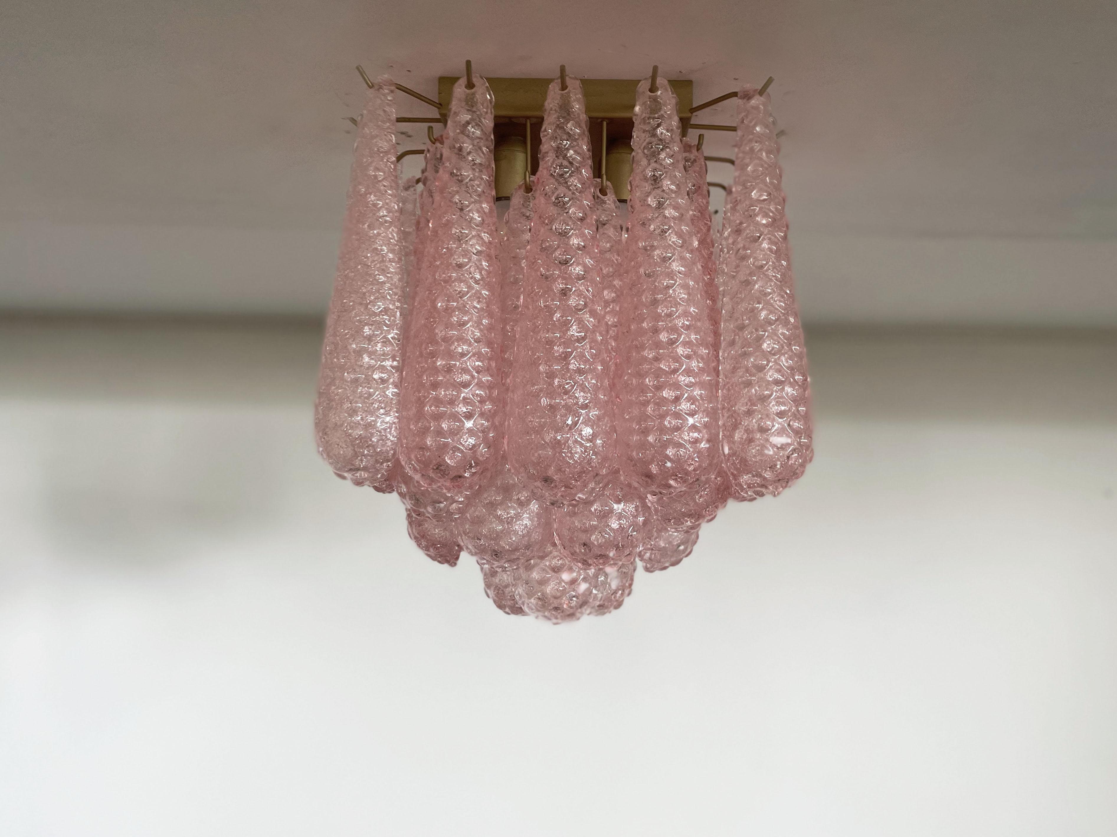 Spectacular ceiling lamp with 32  pink Murano Glasses in golden painted metal frame.  Elegant lighting object.
Period: late xx century
Dimensions: 7,45 inchs (45 cm) height; 13,55 inches (35 cm) depth; 13,55 inches (35 cm) depth.
Dimension glasses: