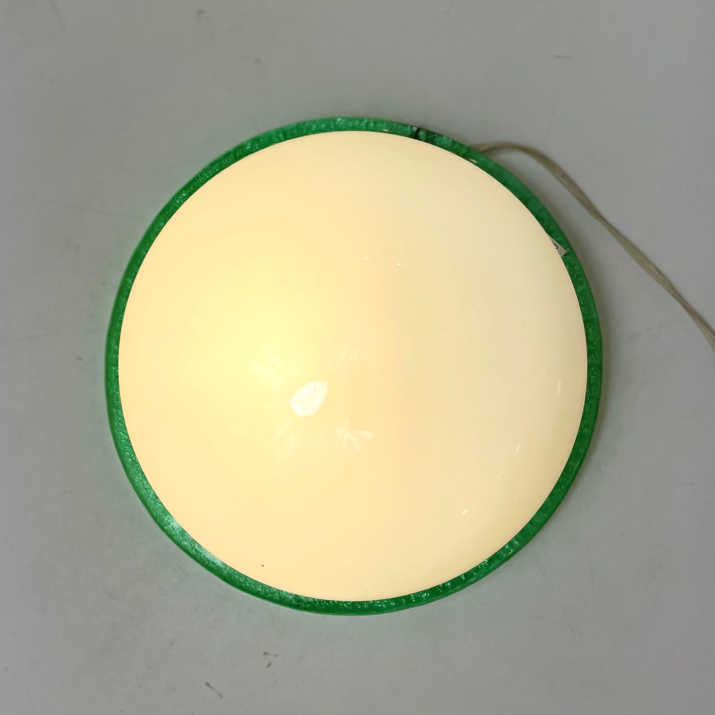 Pop and roundish flush-mounted pendant light made of white opaline with a green textured strapping Murano glass on a white structure. Made in Venice, Italy, by Zanetti in the 1980’s.
-
Designed by: Zanetti Produced in: Murano, Venice, Italy
Design