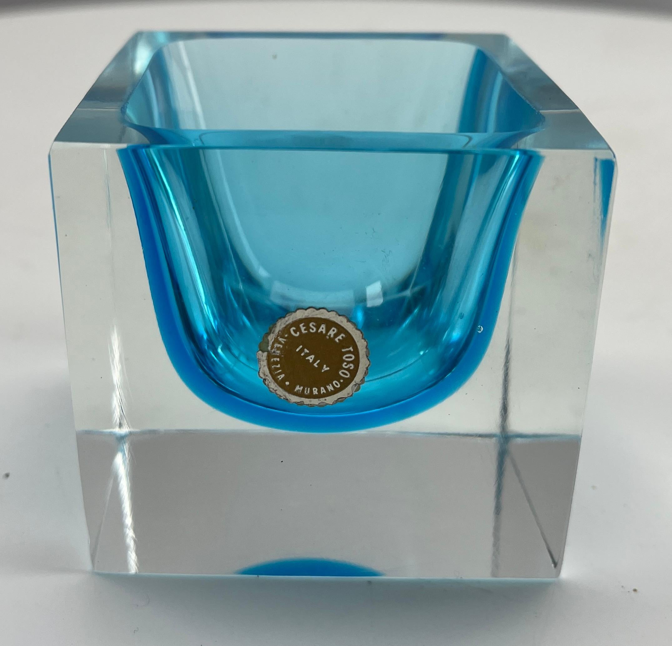 Murano Cesare Toso With A Label Block Vase with  light blue Core
This iconic Murano design takes a Minimalist approach to glass design and turns the focus to the skills of the master craftsmen who could create rigid geometry from a fluid
