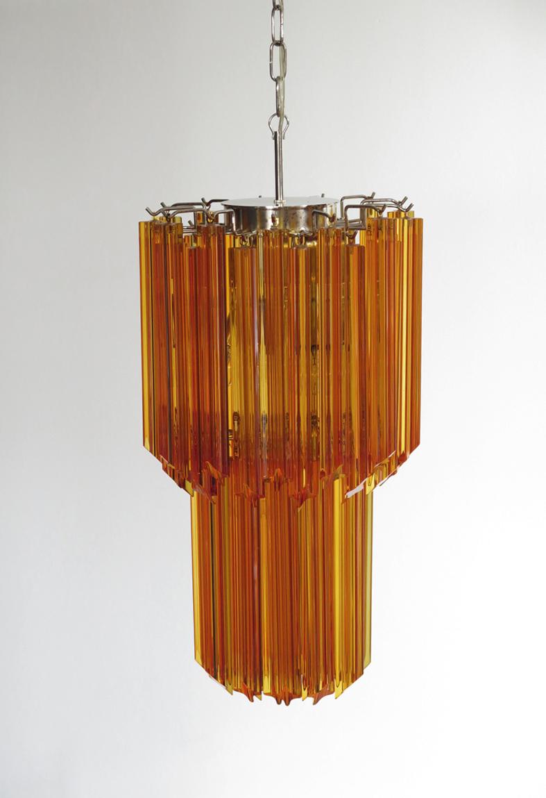 Fantastic vintage Murano chandelier made by 44 Murano amber crystal prism in a nickel metal frame.
Period: late 20th century
Dimensions: 55.10 inches height (140 cm) with chain; 27.50 inches height (70 cm) without chain; 12.6 inches diameter (32