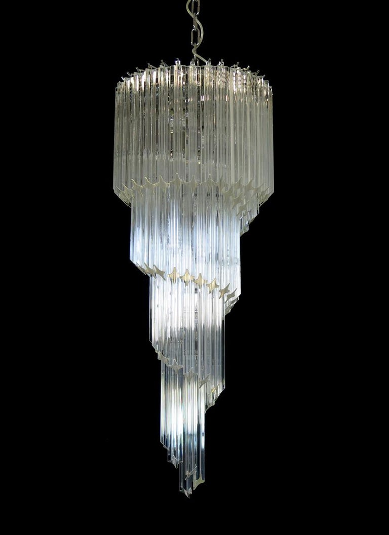 Fantastic vintage Murano chandelier made by 86 Murano crystal transparent prism in a nickel metal frame. The shape of this chandelier is spiral.
Period: Late 20th century.
Dimensions: 63 inches height (160 cm) with chain; 39.40 inches height (100