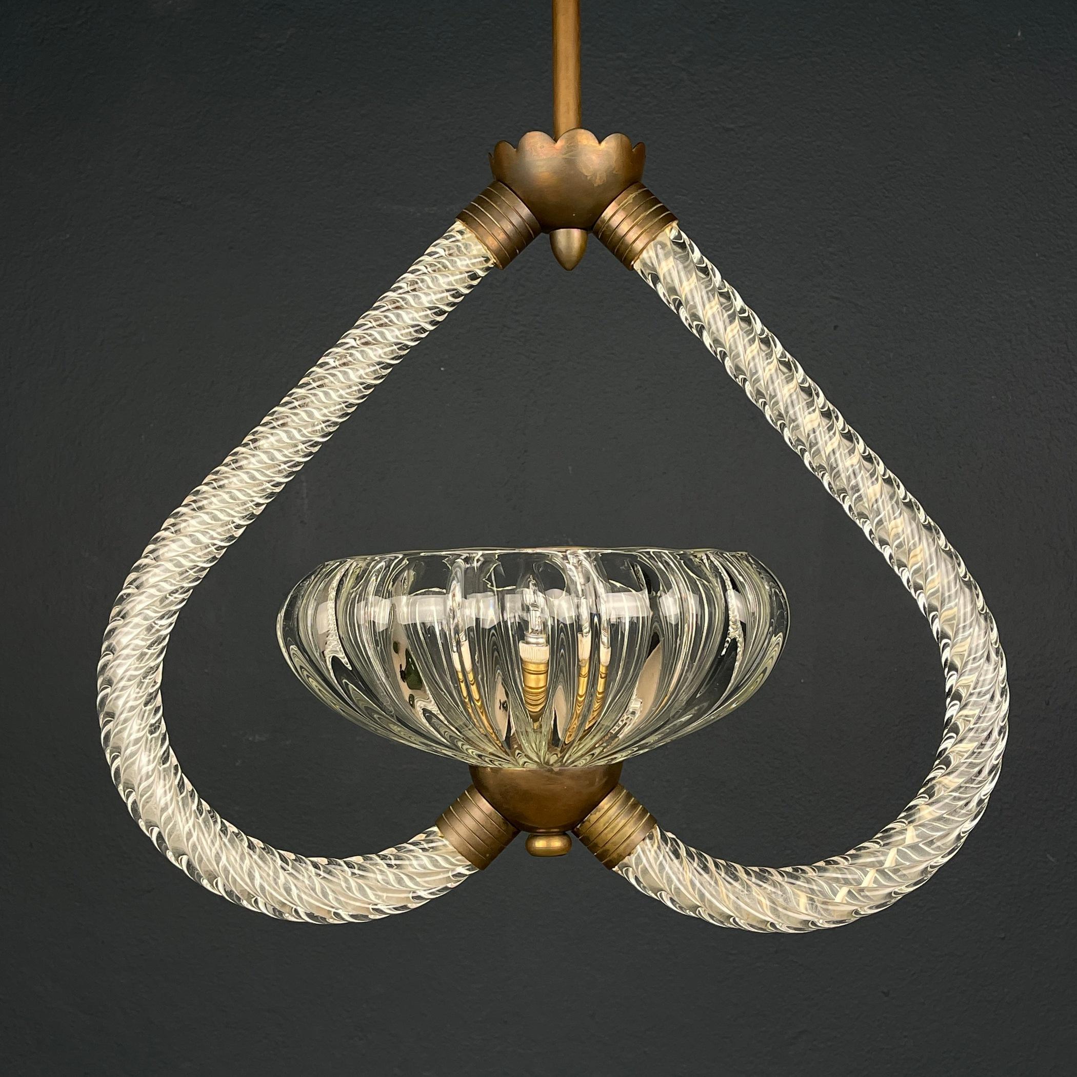 Introduce a touch of timeless elegance with the exquisite Murano Barovier & Toso Chandelier featuring handblown Murano glass suspended from a brass frame. Crafted in Italy during the 1950s, this chandelier is a testament to the artistry and heritage