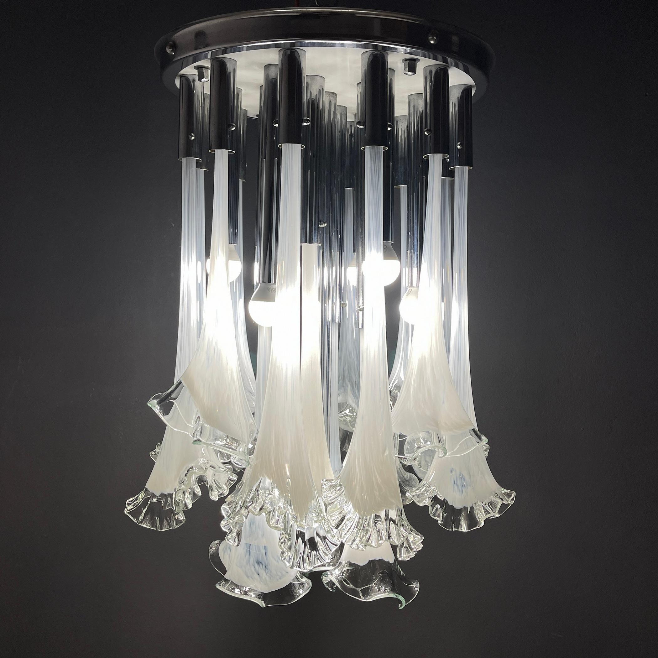 The unique Murano chandelier Calla or Lily by Venini was made in Italy in the 1960s. Beautiful chandelier with glass flowers that seem to fall from a chrome stand. This lamp with its extraordinary design is a highlight for any lounge interior.