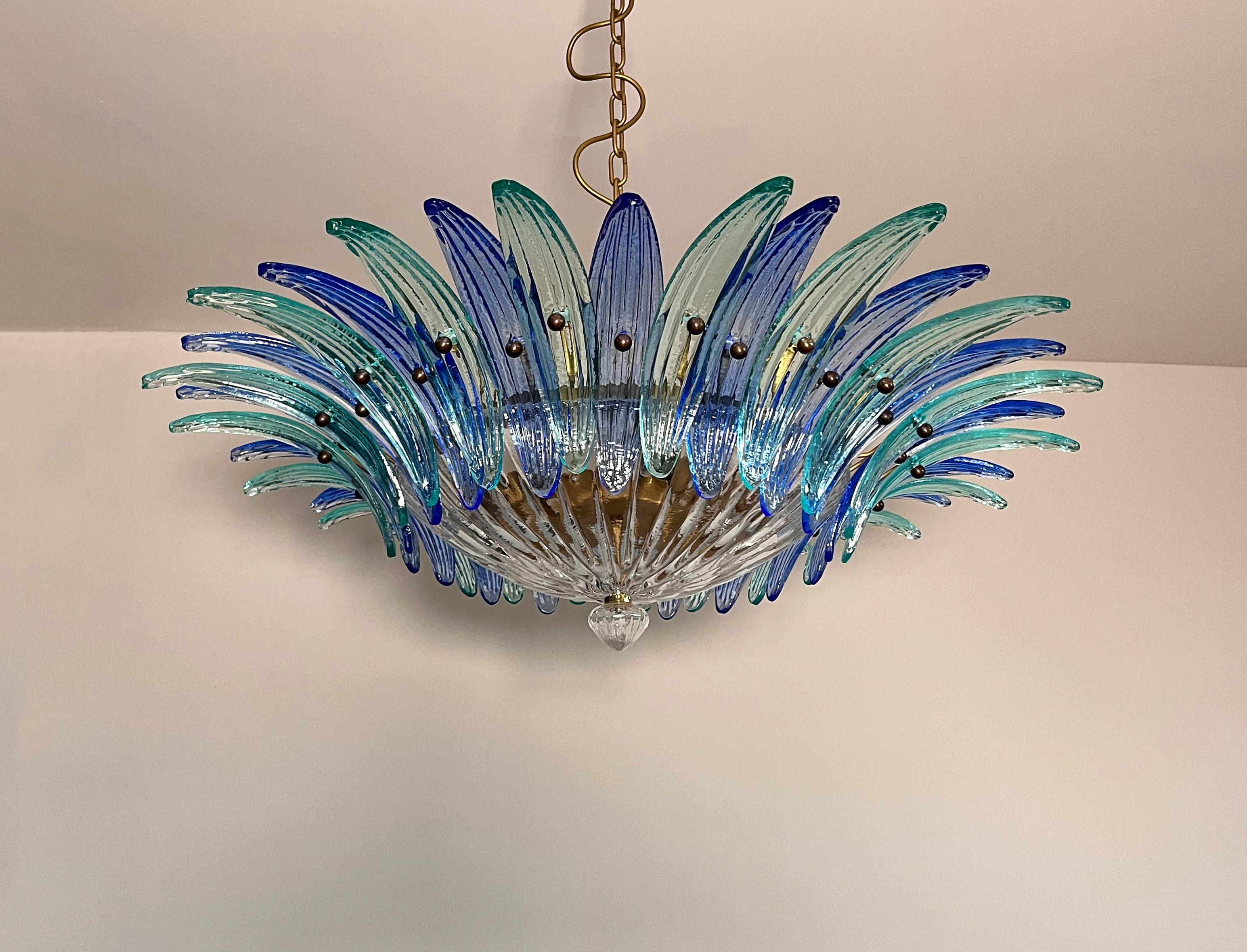 Luxury and GENUINE Murano Glass chandelier. HAND MADE IN MURANO. It made by 36 Muranoblue and turquoise glasses in a gold painted metal frame.  The chandelier has also a Murano transparent glass base in the end of the lamp. Murano blown glass in a