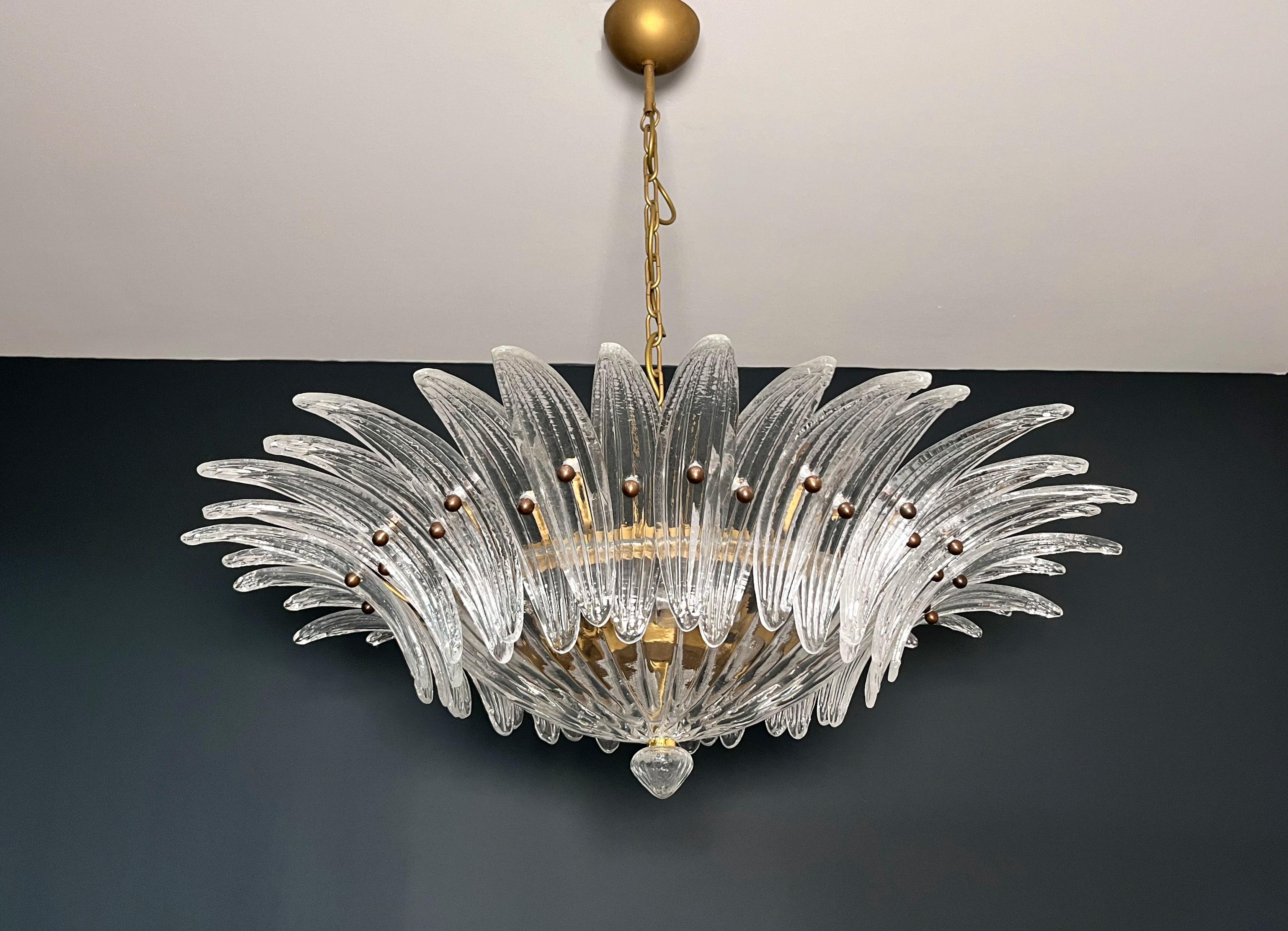 Luxury and GENUINE Murano Glass chandelier. HAND MADE IN MURANO. It made by 36 Murano clear  glasses in a gold painted metal frame.  The chandelier has also a Murano clear glass base in the end of the lamp. Murano blown glass in a traditional