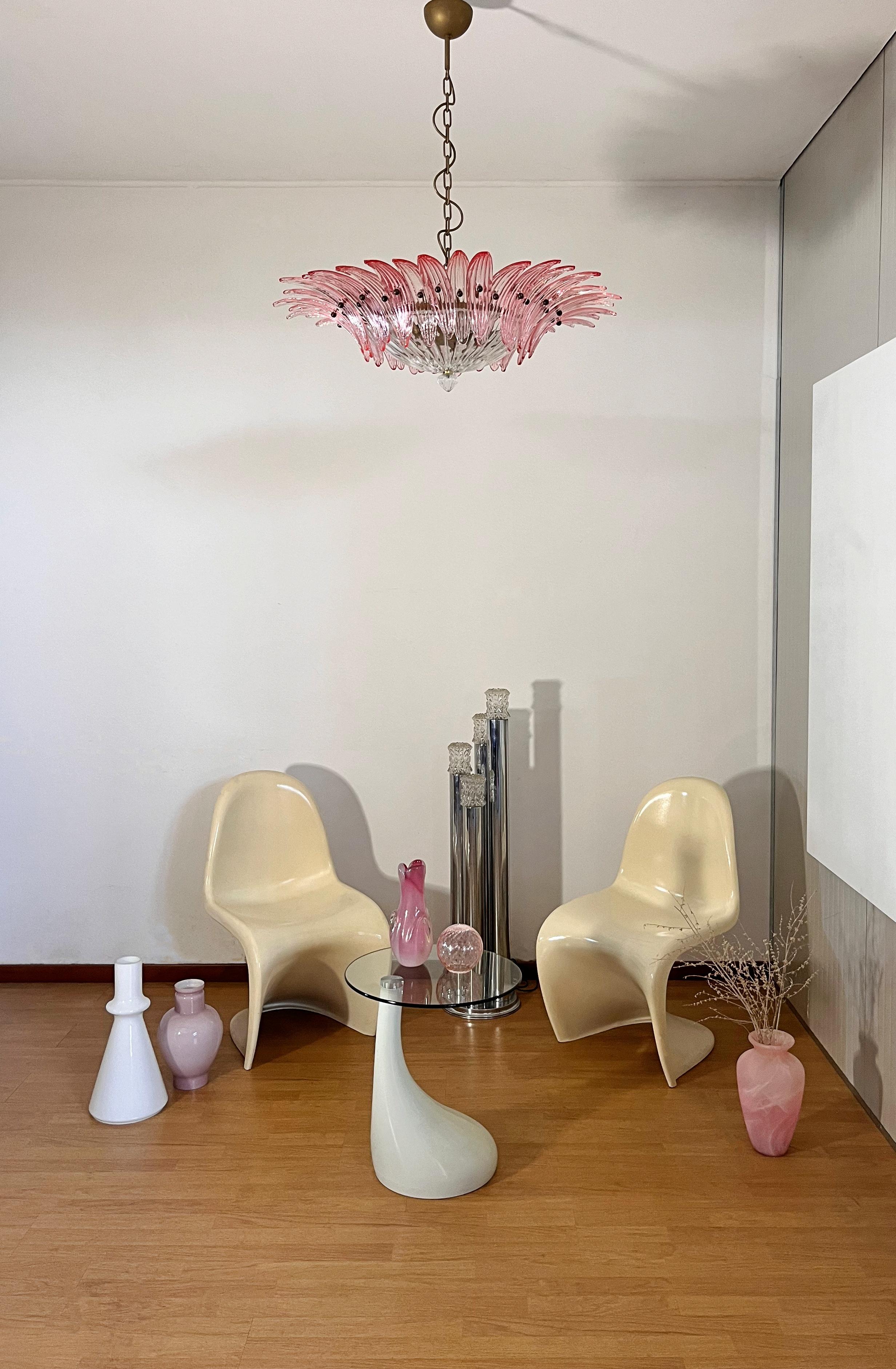 Luxury and GENUINE Murano Glass chandelier. HAND MADE IN MURANO. It made by 36 Murano pink glasses in a gold painted metal frame.  The chandelier also has a Murano transparent glass base at the end of the lamp. Murano blown glass in a traditional