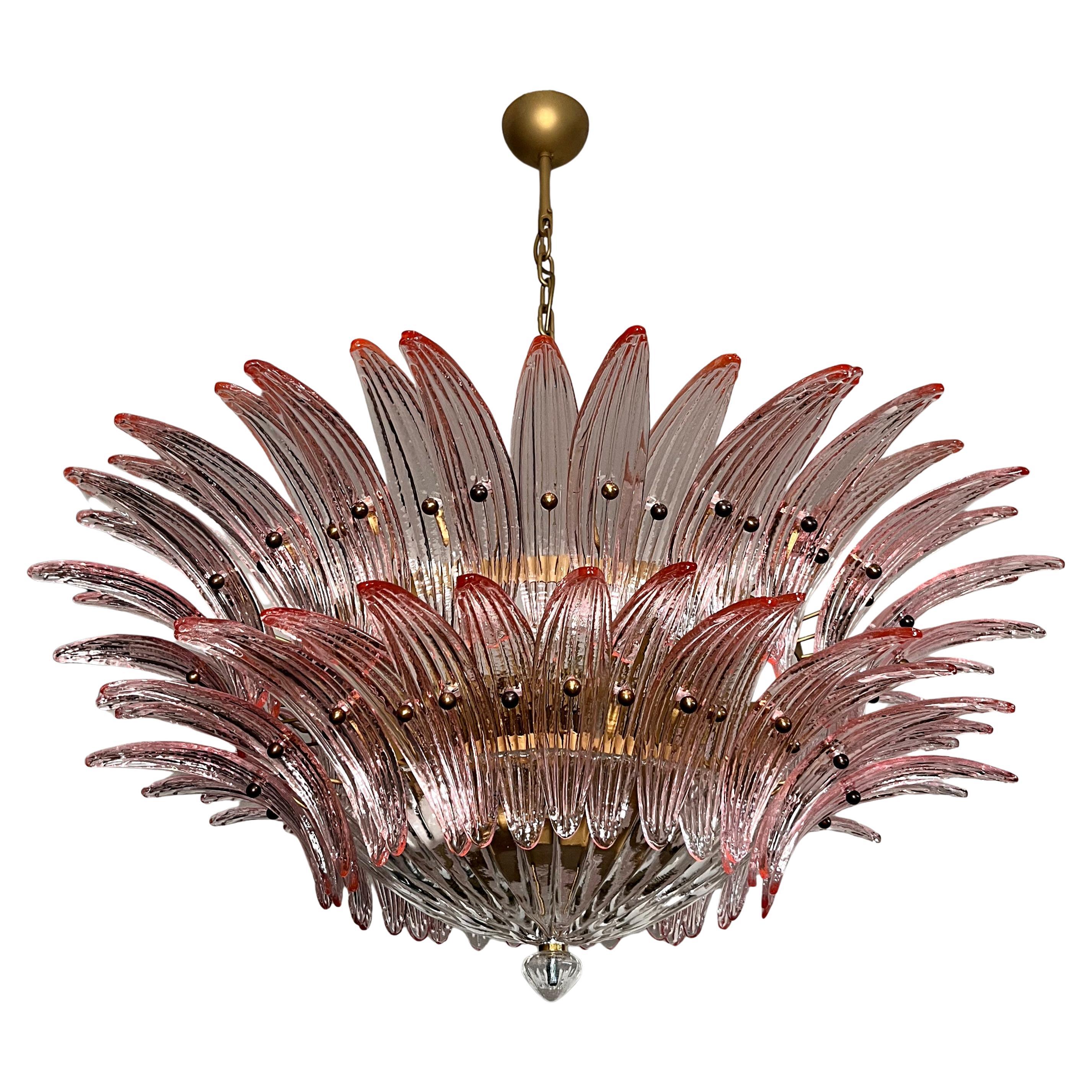 Luxury and GENUINE Murano Glass chandelier. HAND MADE IN MURANO. It made by 82 Murano pink  glasses, two levels,  in a gold painted metal frame.  The chandelier also has a Murano clear glass base at the end of the lamp. Murano blown glass in a