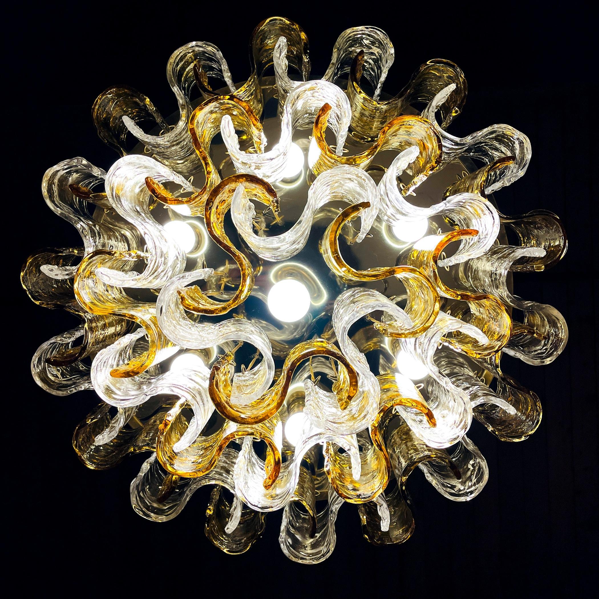 Discover the allure of the past with our absolutely breathtaking vintage Murano glass chandelier, meticulously crafted in Italy during the 1960s. This masterpiece is a testament to the rich heritage of Italian glassblowing, as it showcases the