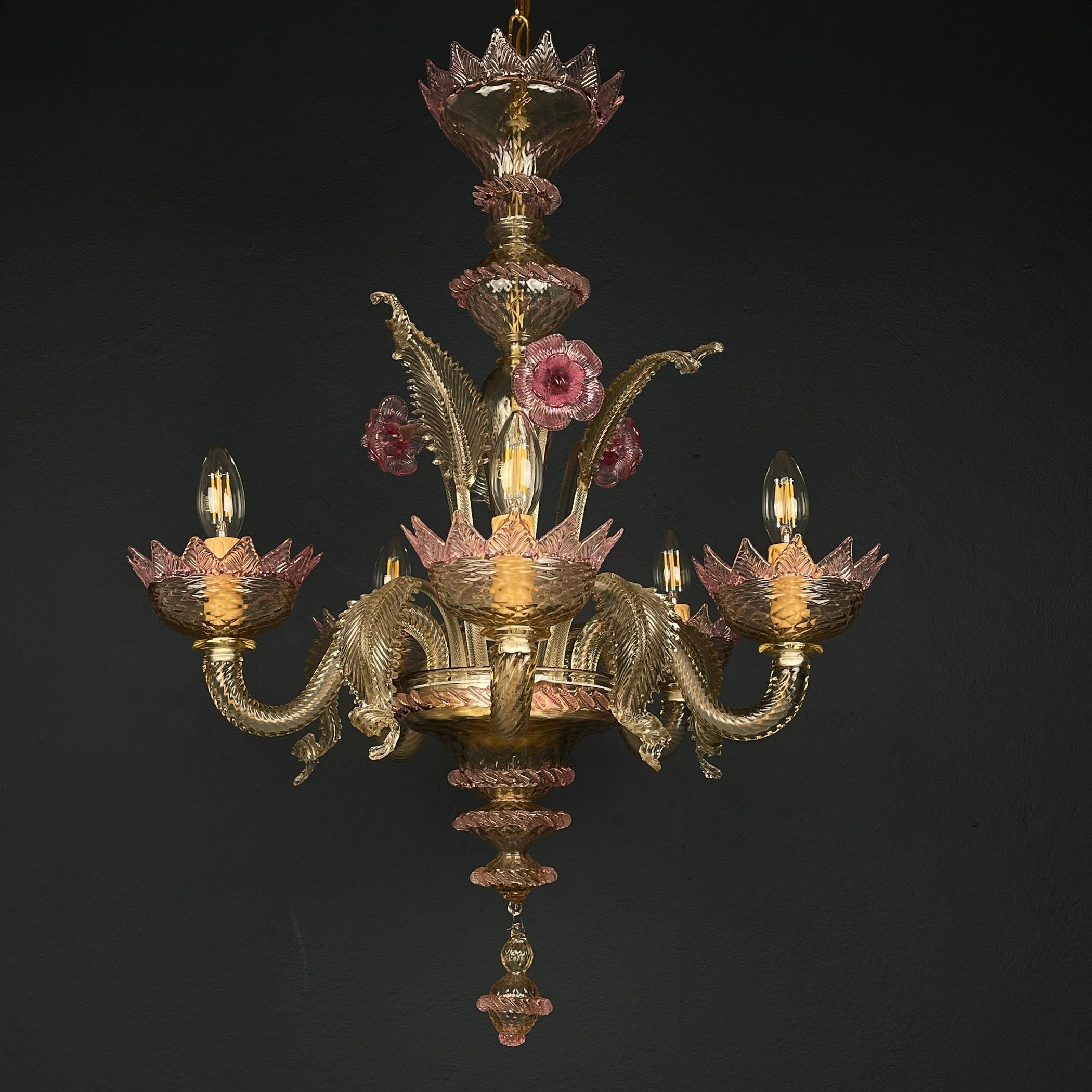 This elegant Murano flower chandelier is a beautiful Italian home decor piece from the 1980s. It features a lovely combination of pink and clear glass, creating a delicate and charming aesthetic. Murano glass is renowned for its craftsmanship and