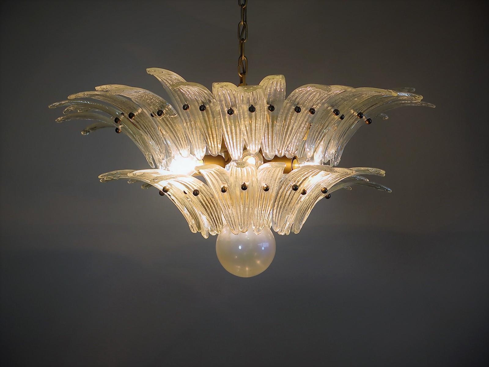 Luxury and GENUINE Murano Glass chandelier. HAND MADE IN MURANO.  It made by 58 Murano crystal
glasses in a gold metal frame.  The chandelier has also a Murano glass ball in the end of the lamp. The originality of this wall sconces is given by the