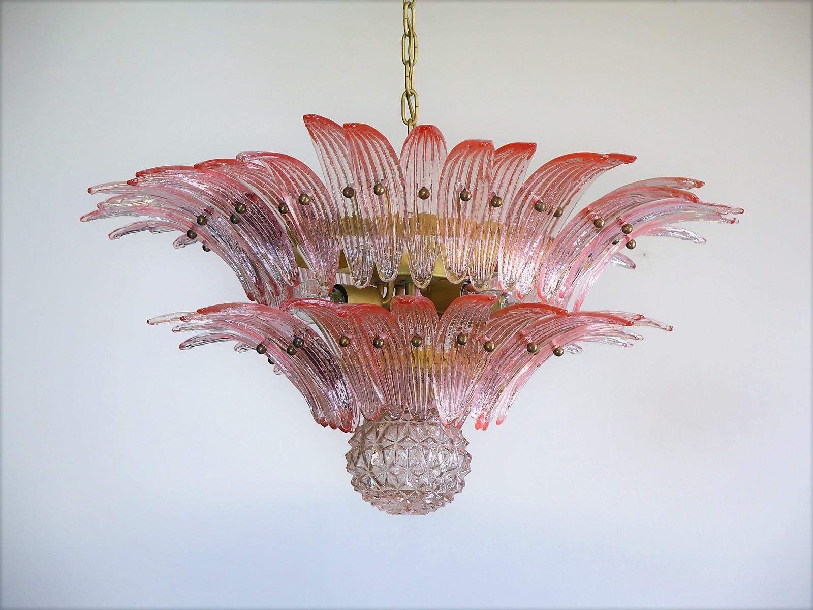 Luxury and genuine Murano glass chandelier. Handmade in Murano. It made by 58 Murano pink crystal glasses in a gold metal frame. The chandelier has also a Murano glass ball in the end of the lamp. Murano blown glass in a traditional way.
Period: