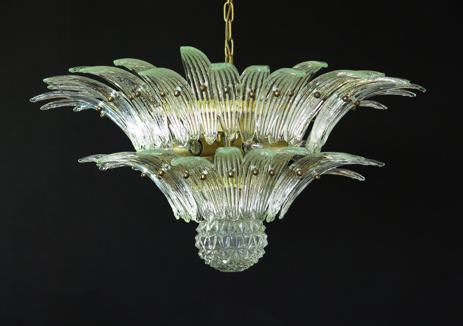 Luxury and genuine Murano glass chandelier. Handmade in Murano. It made by 58 Murano crystal glasses in a gold metal frame. The chandelier has also a Murano glass ball in the end of the lamp. Murano blown glass in a traditional way.
Period: 1970s /