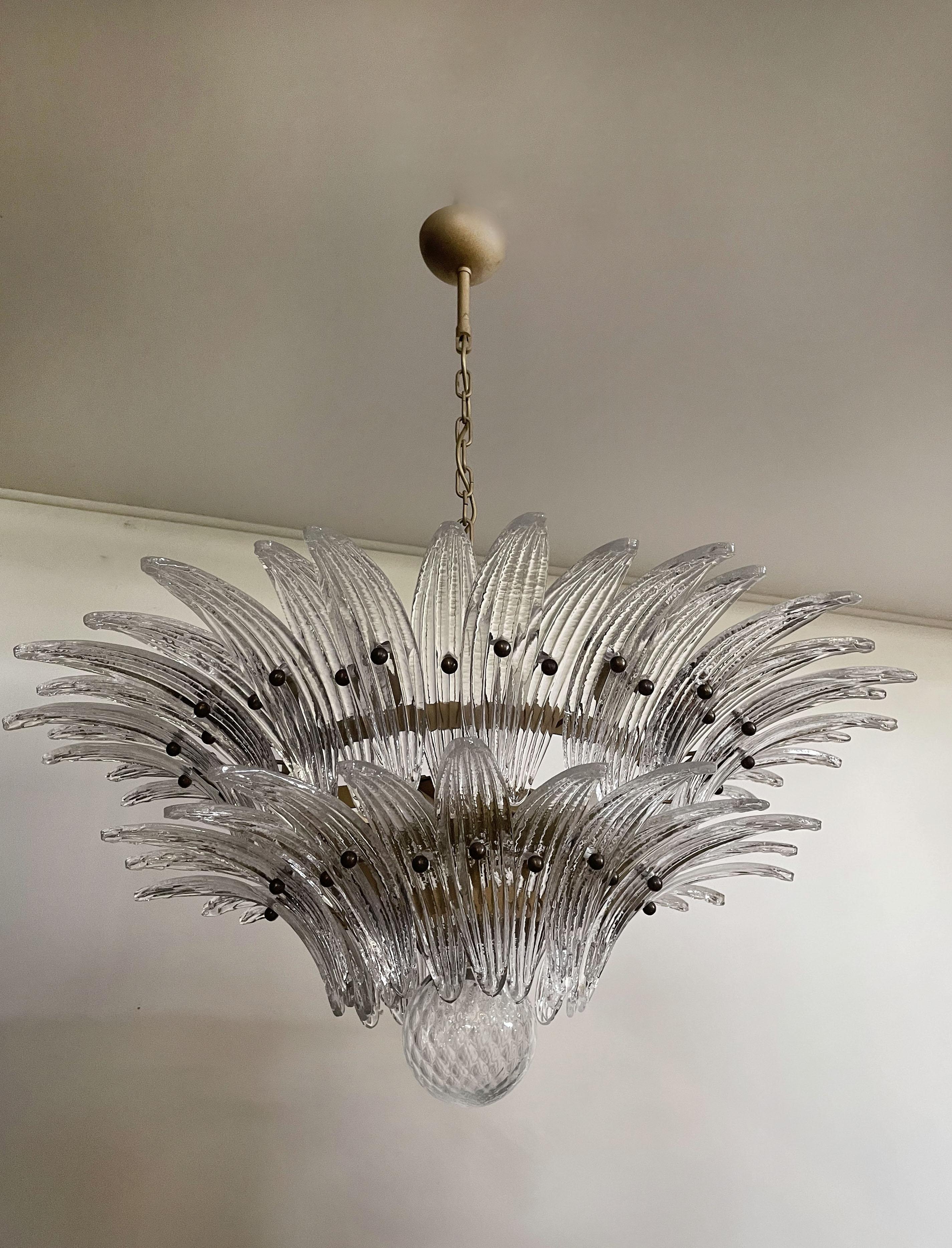 Luxury and GENUINE Murano Glass chandelier. HAND MADE IN MURANO. It made by 58 Murano crystal glasses in a gold metal frame. The chandelier has also a Murano glass ball in the end of the lamp. Murano blown glass in a traditional way.
Period: 1970's