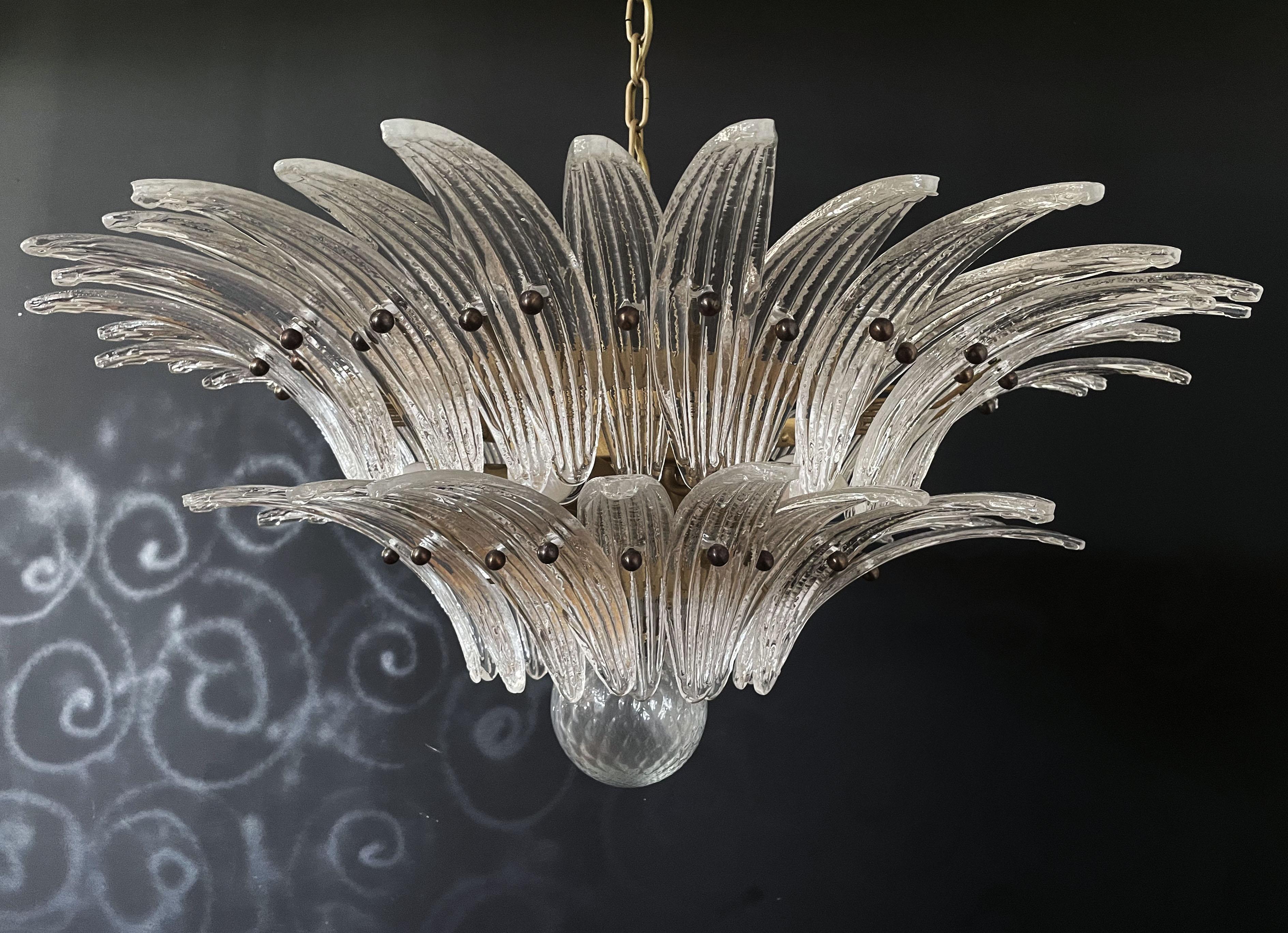 Luxury and GENUINE Murano Glass chandelier. HAND MADE IN MURANO. It made by 58 Murano crystal glasses in a gold metal frame. The chandelier has also a Murano glass ball in the end of the lamp. Murano blown glass in a traditional way.
Period: late