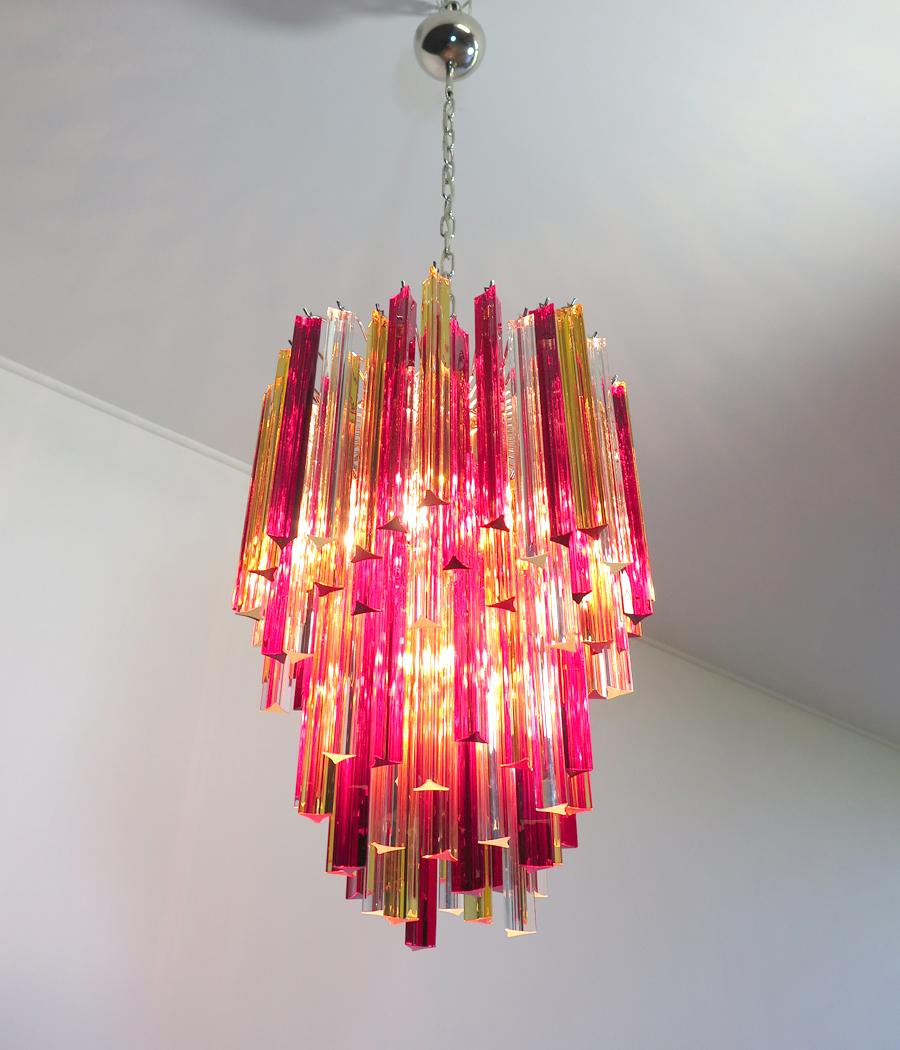 Fantastic vintage Murano chandelier made by 92 Murano crystal multicolored prism in a nickel metal frame. The glasses are transparent, red and yellow.
Period: late 20th century
Dimensions: 53.15 inches height (135 cm) with chain; 29.50 inches