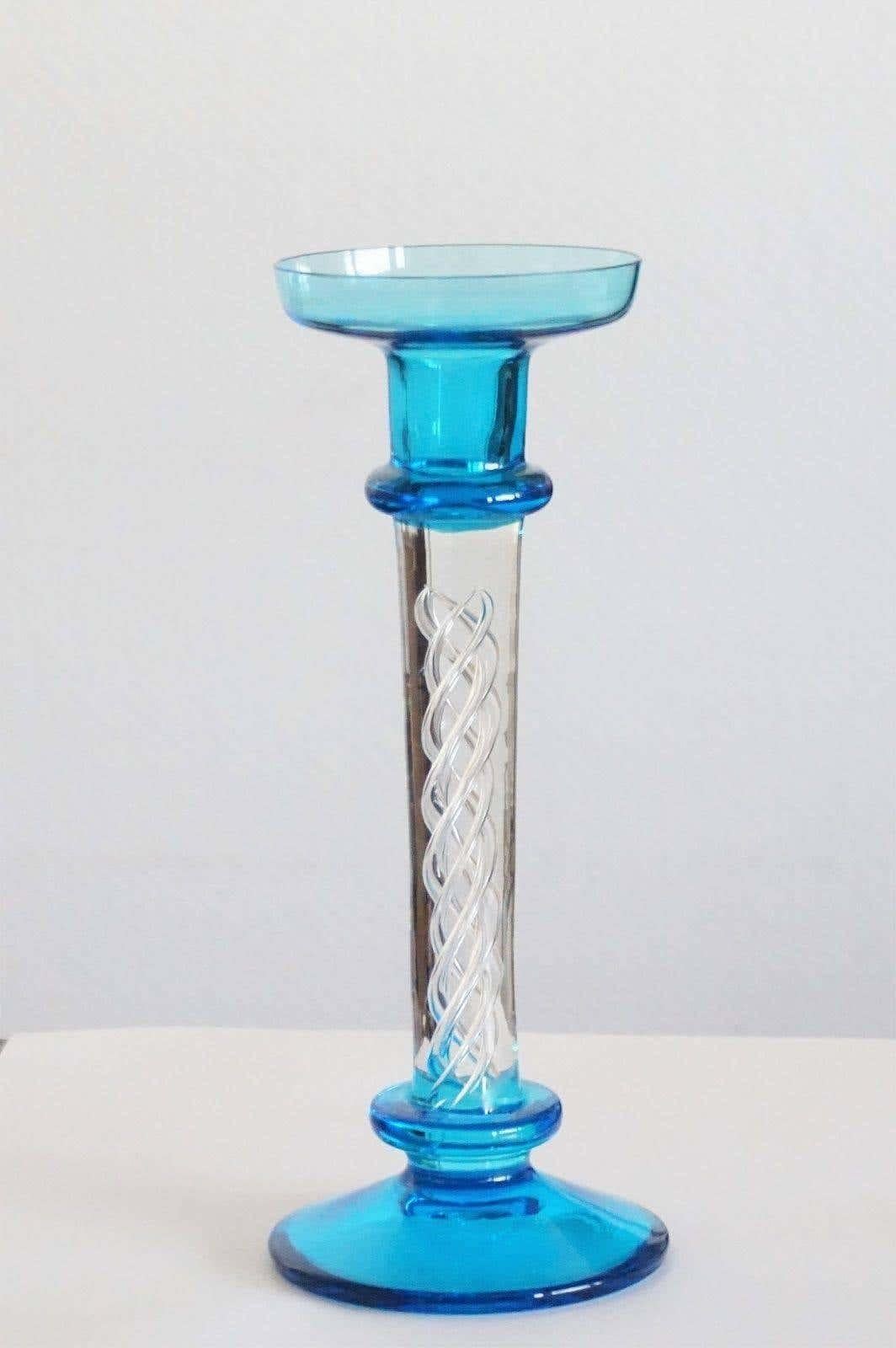 A very elegant Murano clear and turquoise glass candlestick with beautiful glass artwork inside, Italy, 1960s, without damage.
Measures: Height 9.45 in (24 cm)
Diameter/base 3.94 in (10 cm)
Diameter/top 3.35 in (8.50 cm.

