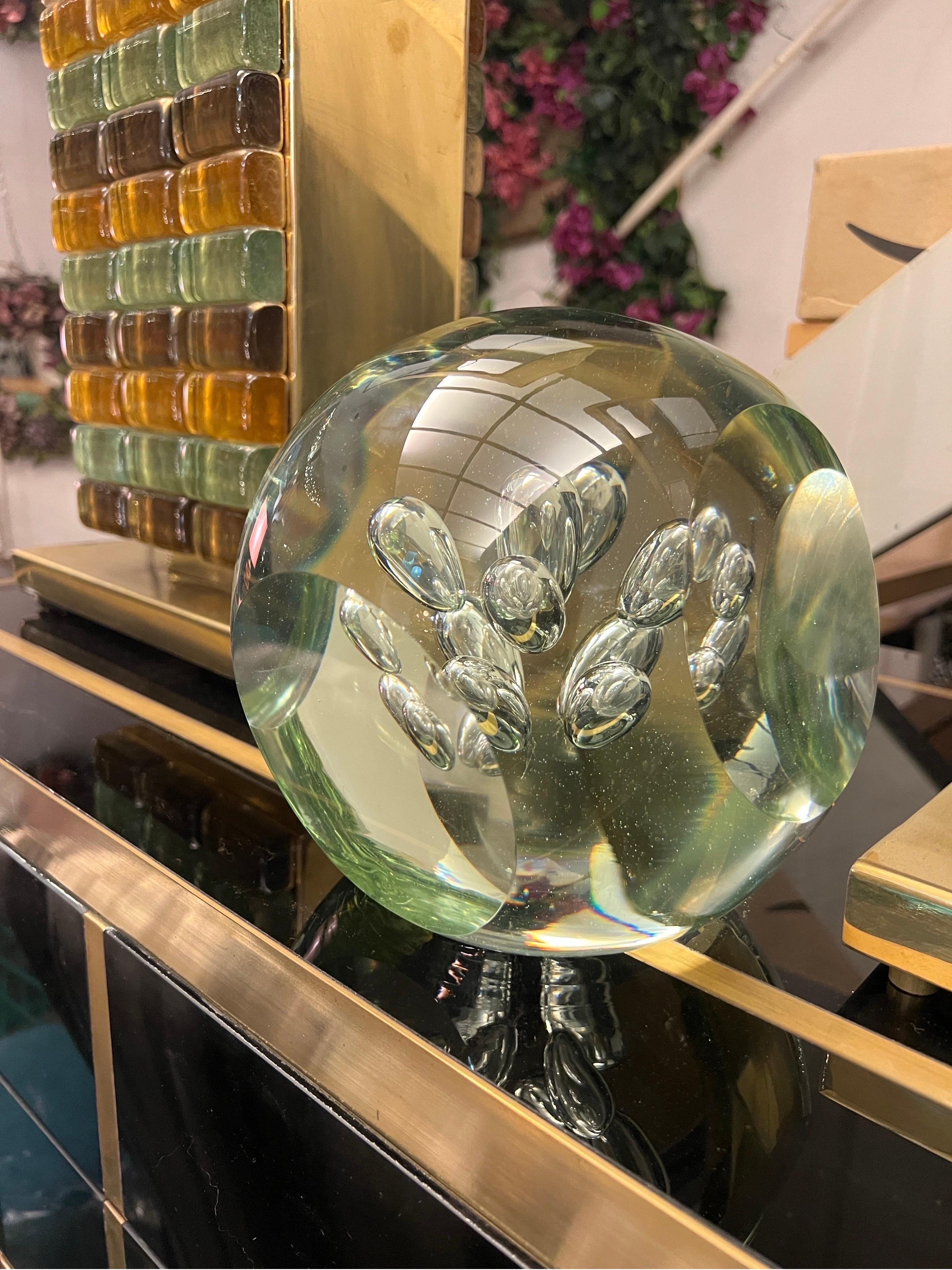 Murano Clear Glass Paperweight Air Bubbles Included, it could be also a desk accessory. The glass sculture is solid and heavy, the air bubbles have been handblown and the sphere have five geomatic cuts.