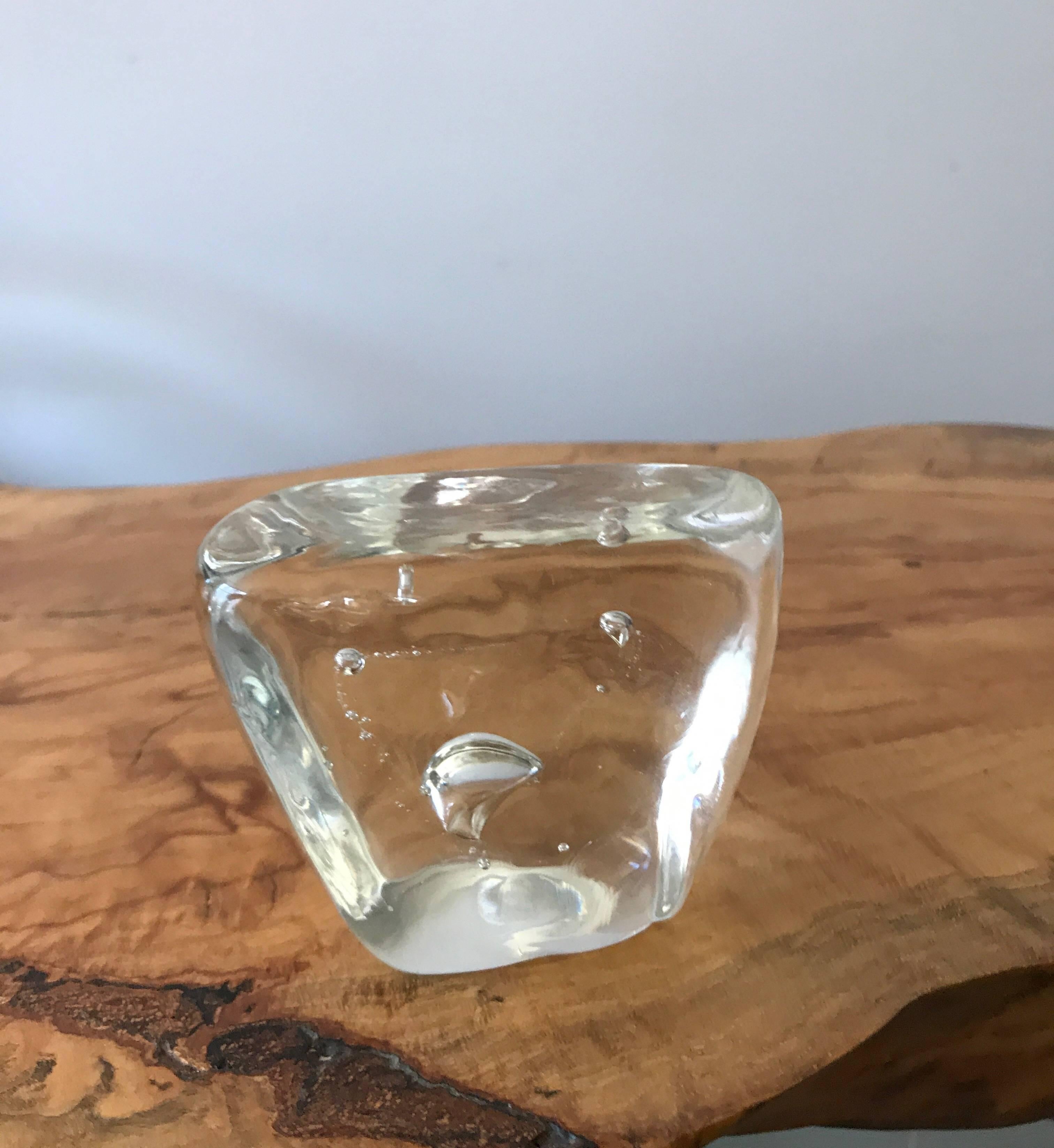 An asymmetric clear Murano glass paperweight with bubble inclusions in the style of Barbini. 
Nice tabletop decorative object desk accessory.
 