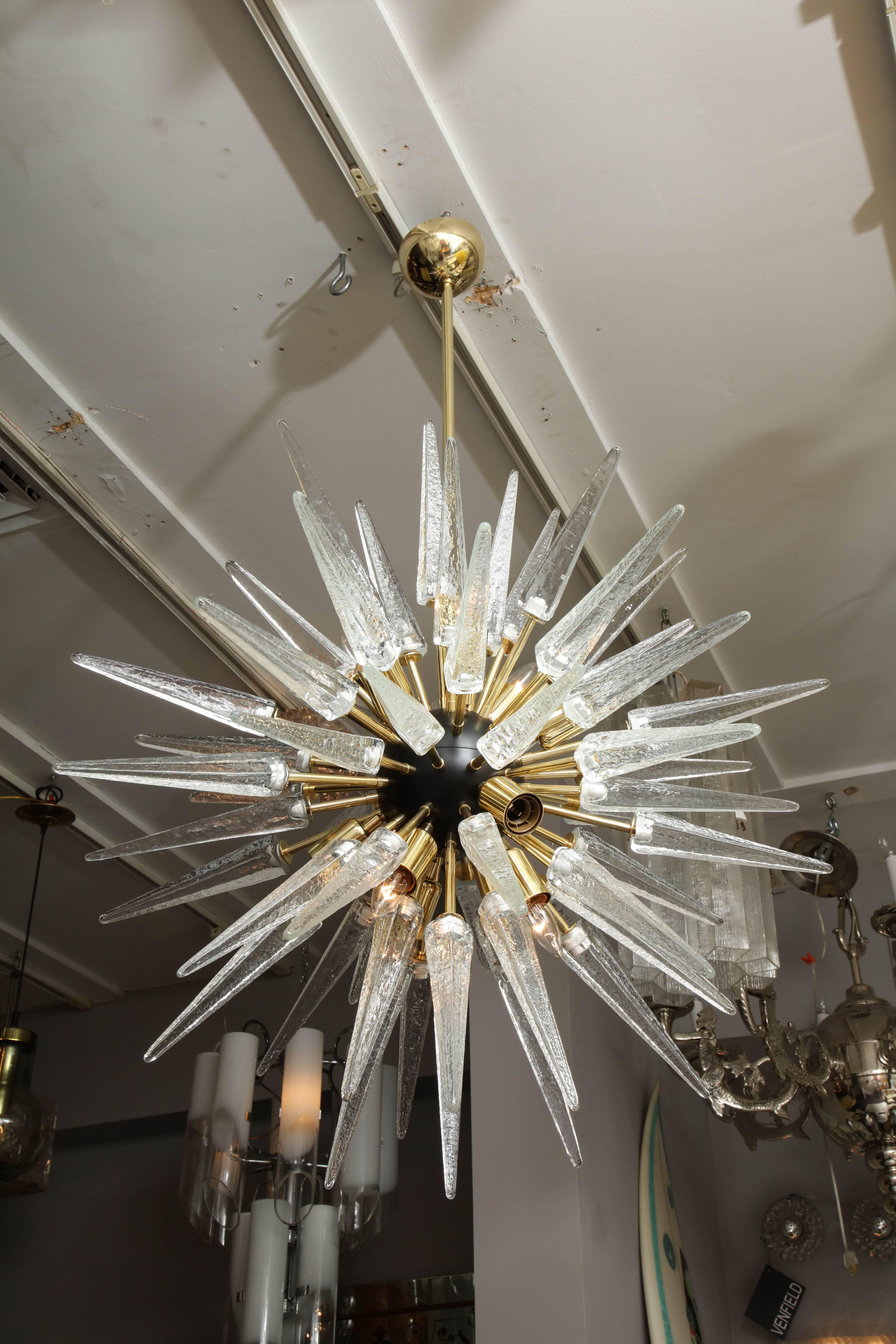 Custom, made to order,  clear Murano glass spike Sputnik chandelier with ebonized center and brass arms.