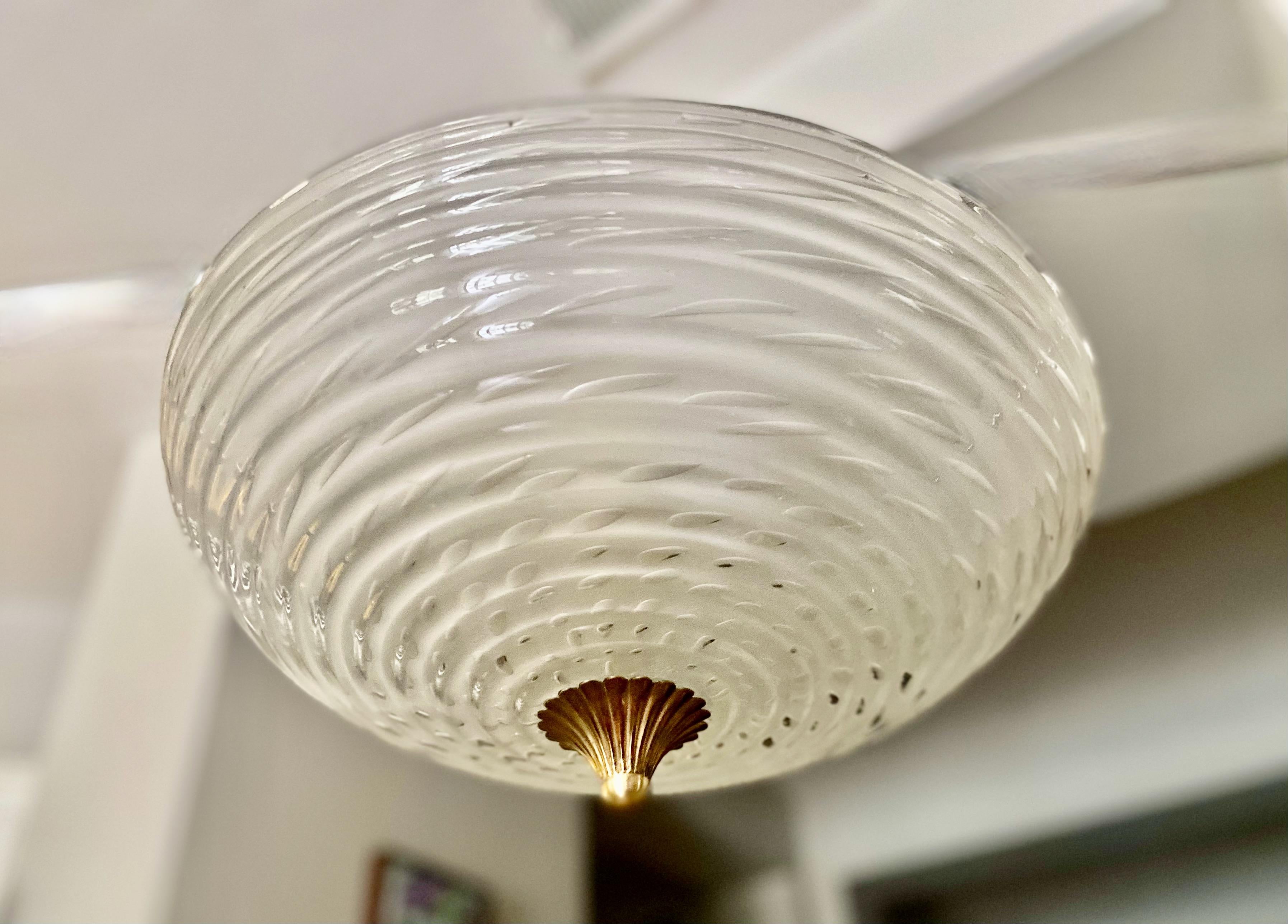 Murano Italian round opague handblown glass flush mount ceiling light. The clear opague glass has matte sandblasted interior, outer bowl has horizontal ribbing, and incased with tons of bubbles (bullicante technique) throughout. Glass bowl affixed