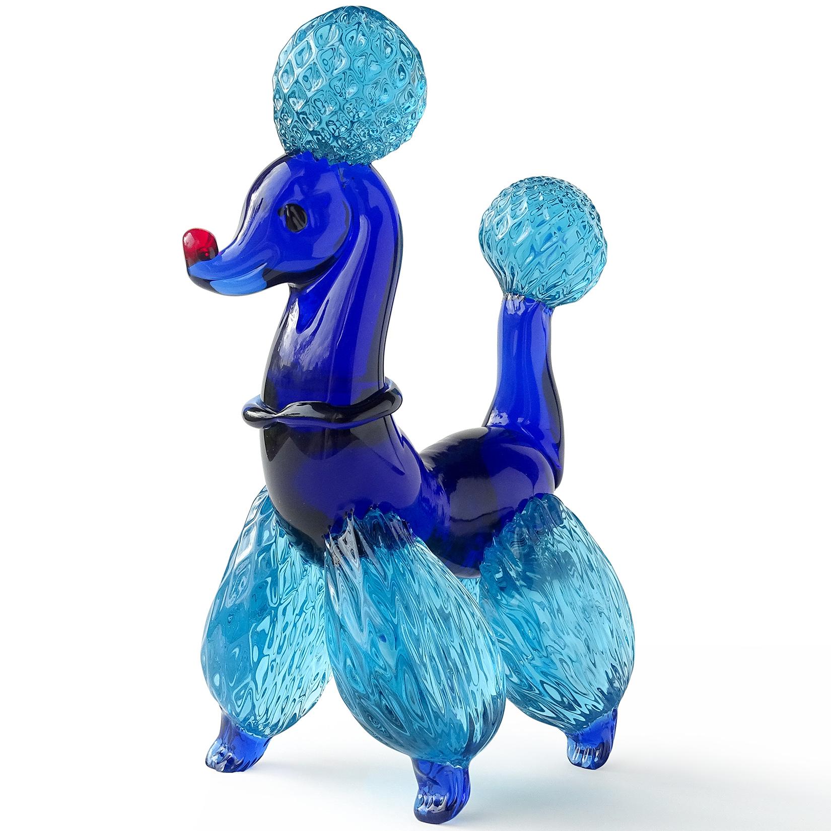 Beautiful Murano hand blown cobalt blue Italian art glass poodle puppy dog sculpture. It has a quilted pom-pom design on the legs, tails and puff on its head. Blue collar on its neck. Very well groomed French poodle, ready for any dog show. One of