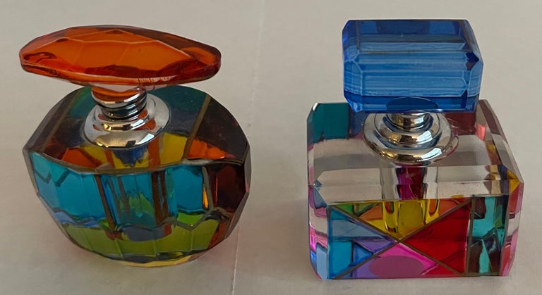 Pair of mid-century Murano colored glass perfume bottles. Each bottle retains Murano Sticker on the underside. The rectangular bottle does not have a glass wand attachment.