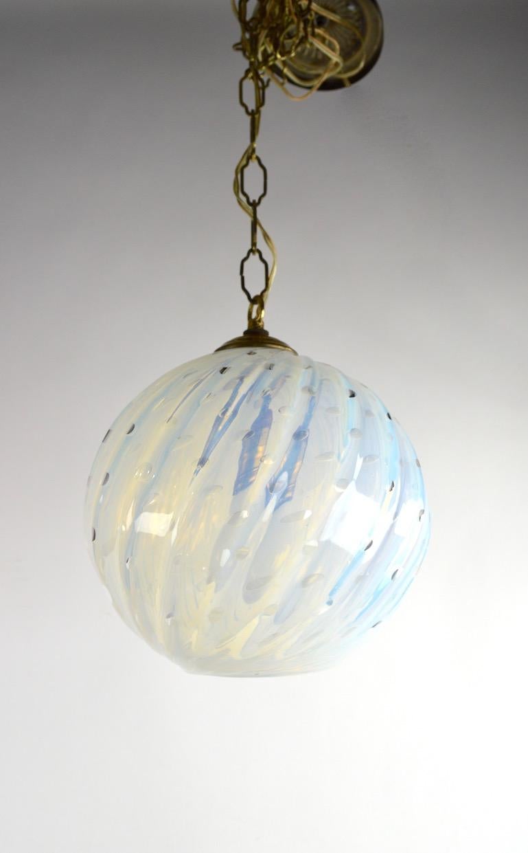 Nice Murano art glass controlled bubble hanging glass ball shade, in clean, original and working condition. The glass is opalescent in tone, free of damage or condition issues. From Murano Italy, in the style of Seguso. Height in listing, 106