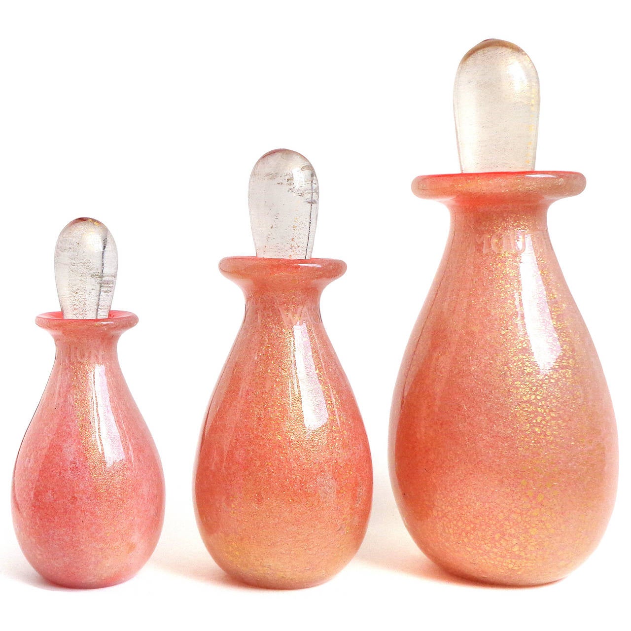 Incredible Murano hand blown container and stoppered bottles, in coral orange and gold leaf Italian art glass bathroom / vanity set. Attributed to the Seguso Vetri D' Arte company, circa 1930s-1940s. Created in the 