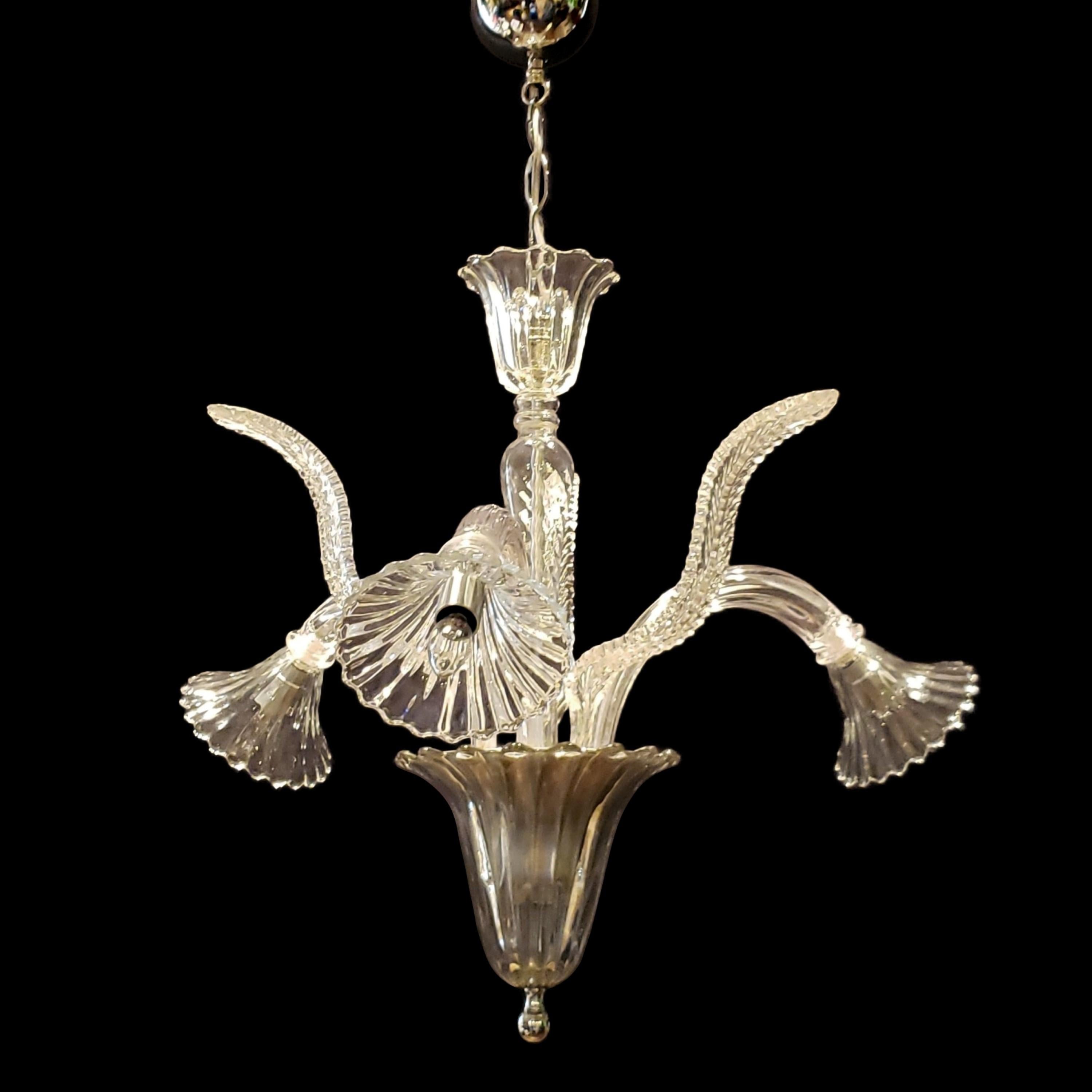 Late 20th Century Murano clear crystal chandelier with three J shaped arms and narrow up leaves. This comes rewired and ready to install. Ships disassembled. Cleaned and restored. Please note, this item is located in our Scranton, PA location.