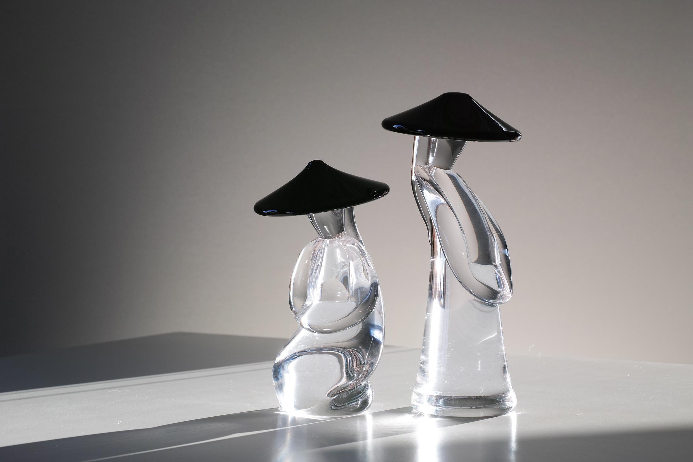 For your consideration is this signed pair of Murano figural sculptures by Renato Anatra. The figures are comprised of heavy, clear crystal and opaque black crystal. Both are hand signed on the bottom and one has the original Vetri Murano