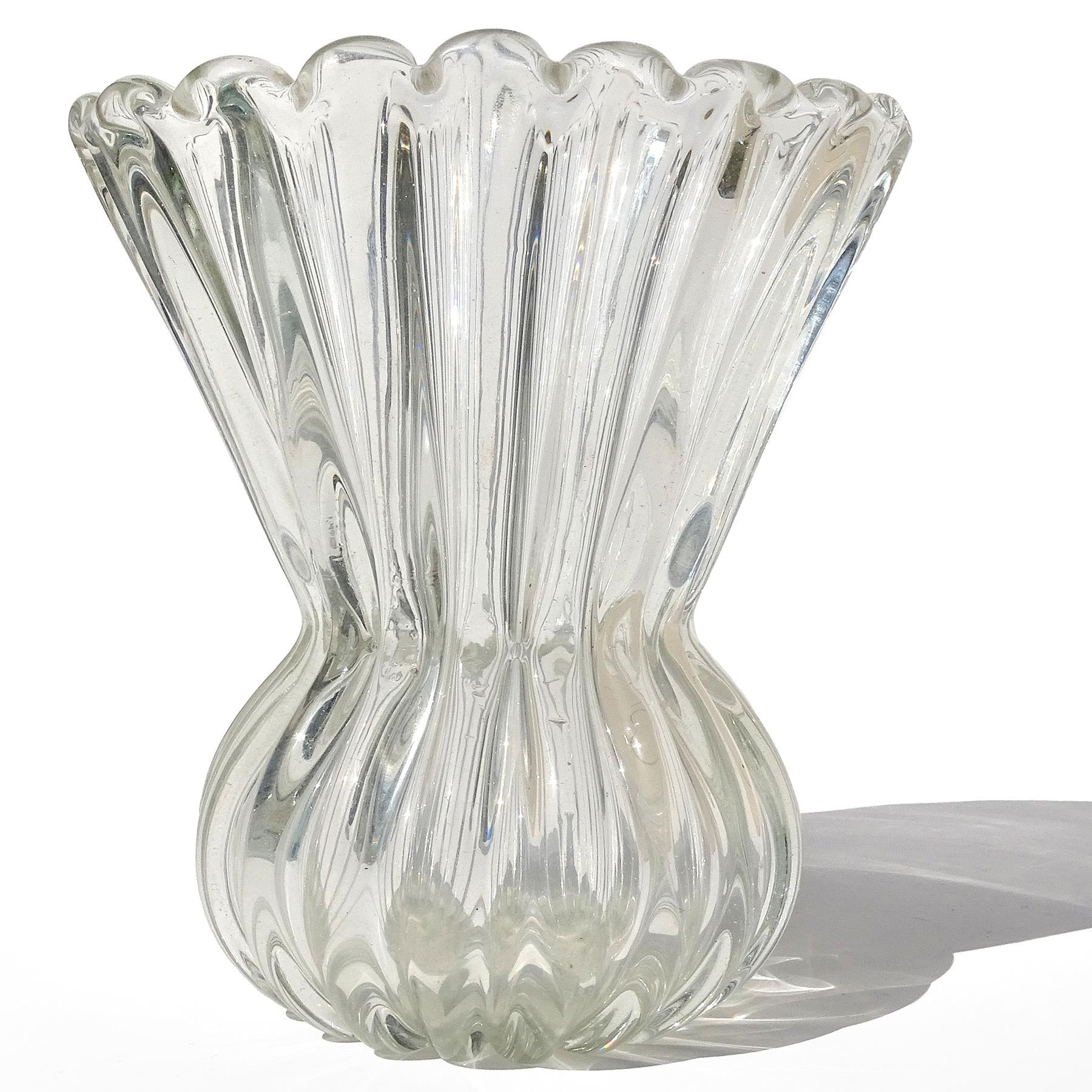 Beautiful vintage Murano hand blown crystal clear Italian art glass flower vase. Created in the manner of Seguso Vetri d'Arte and Archimede Seguso. The vase has a cinched waist and flared out fan shape rim. It is made of thick glass with a ribbed