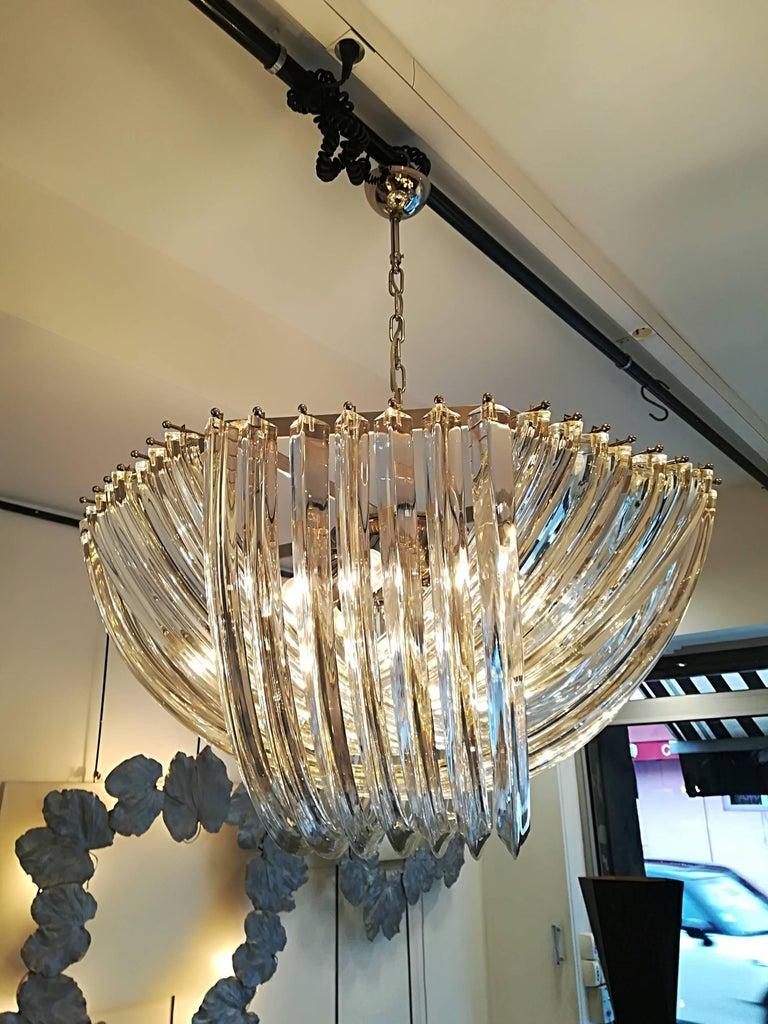 Murano handblown clear crystal glass chandelier.

Fixture in plated chrome.
Measures: Diameter 80 cm
6 bulbs E27/E ( wired for europe or USA)
Measures: Height (40 cm) is only for the basket.
Total H 120cm can be reduced or increased.
