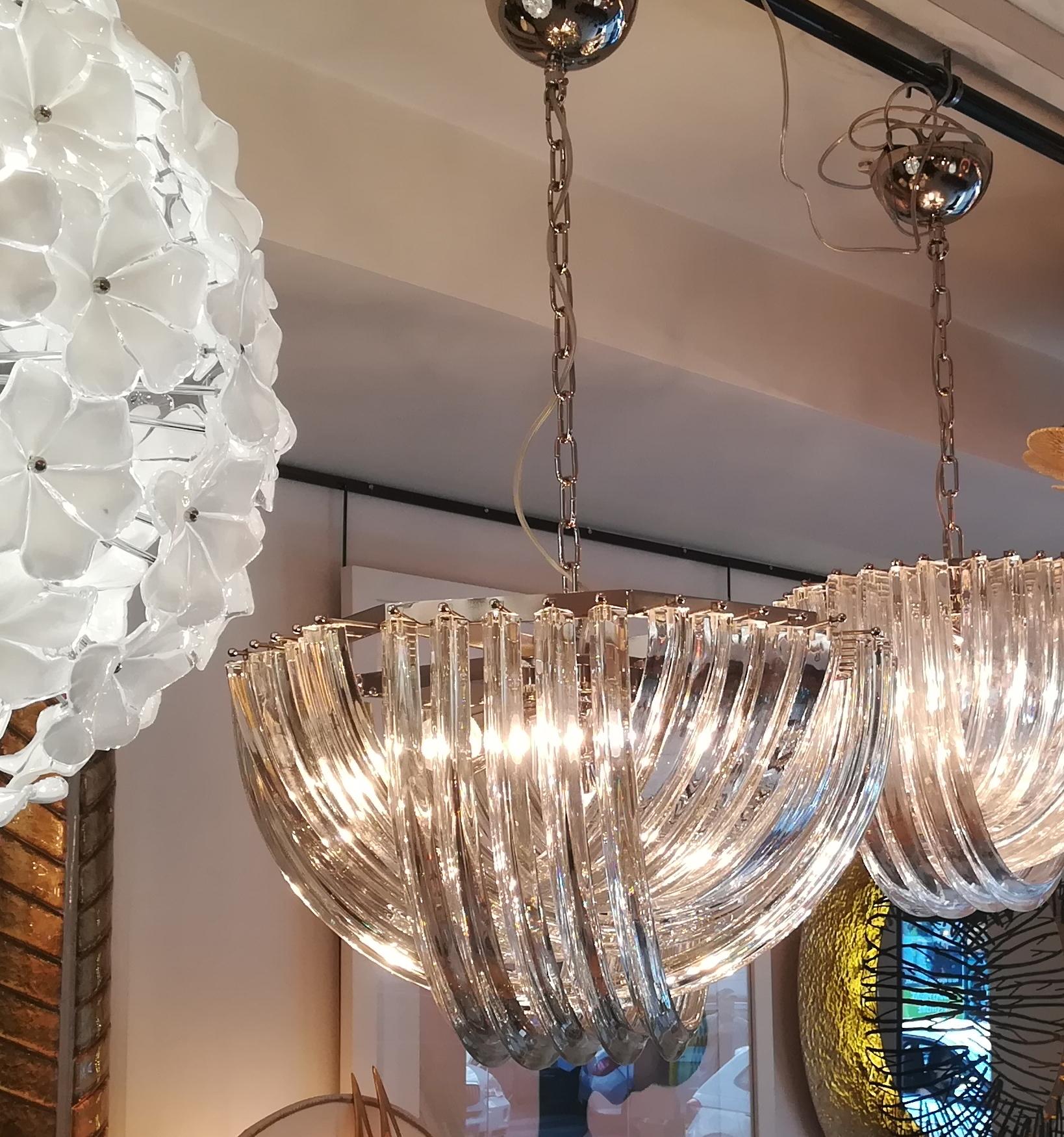 Murano hand blown clear crystal glass chandelier.

Fixture in plated chrome.
Measures: Diameter 60 cm
Five bulbs E27
Measures: Height (40 cm) is only for the basket.
Total H 100cm can be reduced or increased.
 