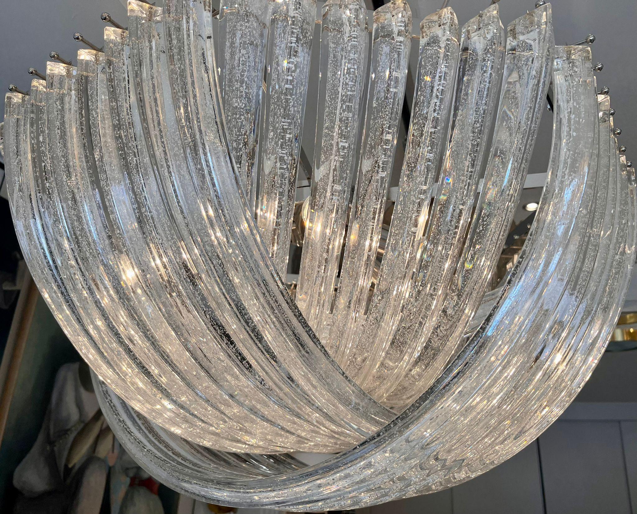 Murano handblown sparling(silver glitters) clear crystal glass chandelier.

Fixture in plated chrome.
Measures: Diameter 80 cm
Six E27/E26 bulbs ( wired for Europe or USA)
Measures: Height (40 cm) is only for the basket.
Total H 120cm can be reduced