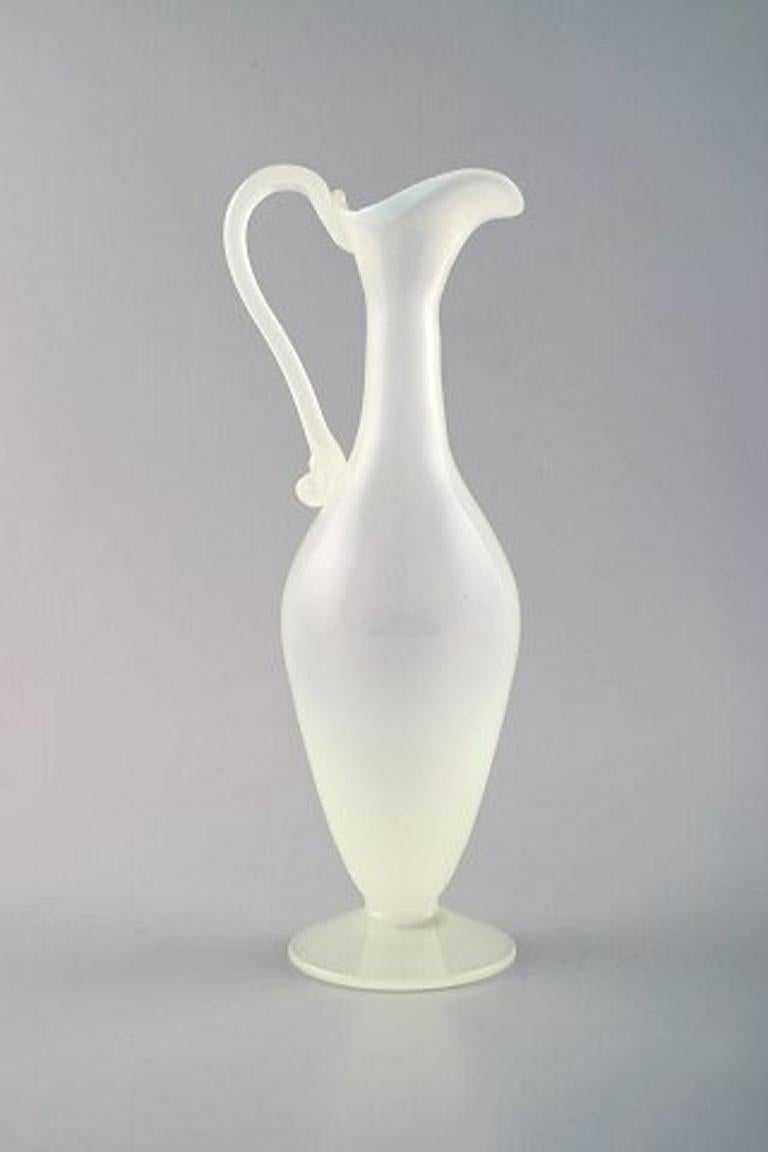 Murano decanter in light mouth blown art glass. 1960s.
In perfect condition.
Measures: 23 x 9 cm.
