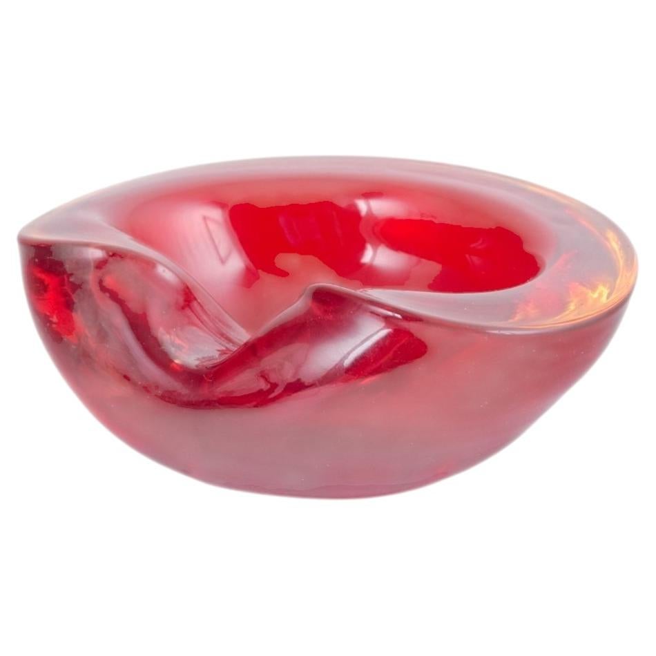 Murano. Decorative bowl with organic form in red sommerso glass. 1960s/70s