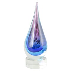 Murano drop-shaped sculpture in clear and blue-violet art glass. 1970s.