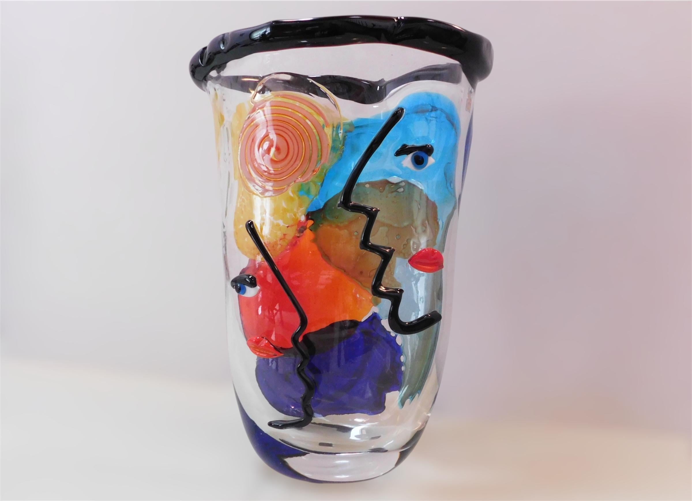Italian multicolor Murano art glass vase hand blown to form abstract faces / Made in Italy by Giuliano Busato, circa 1990s
Original maker's mark underside
Measures: Height 15.5 inches, width 11 inches, depth 9 inches
Opening 9.5 x 7 inches
1