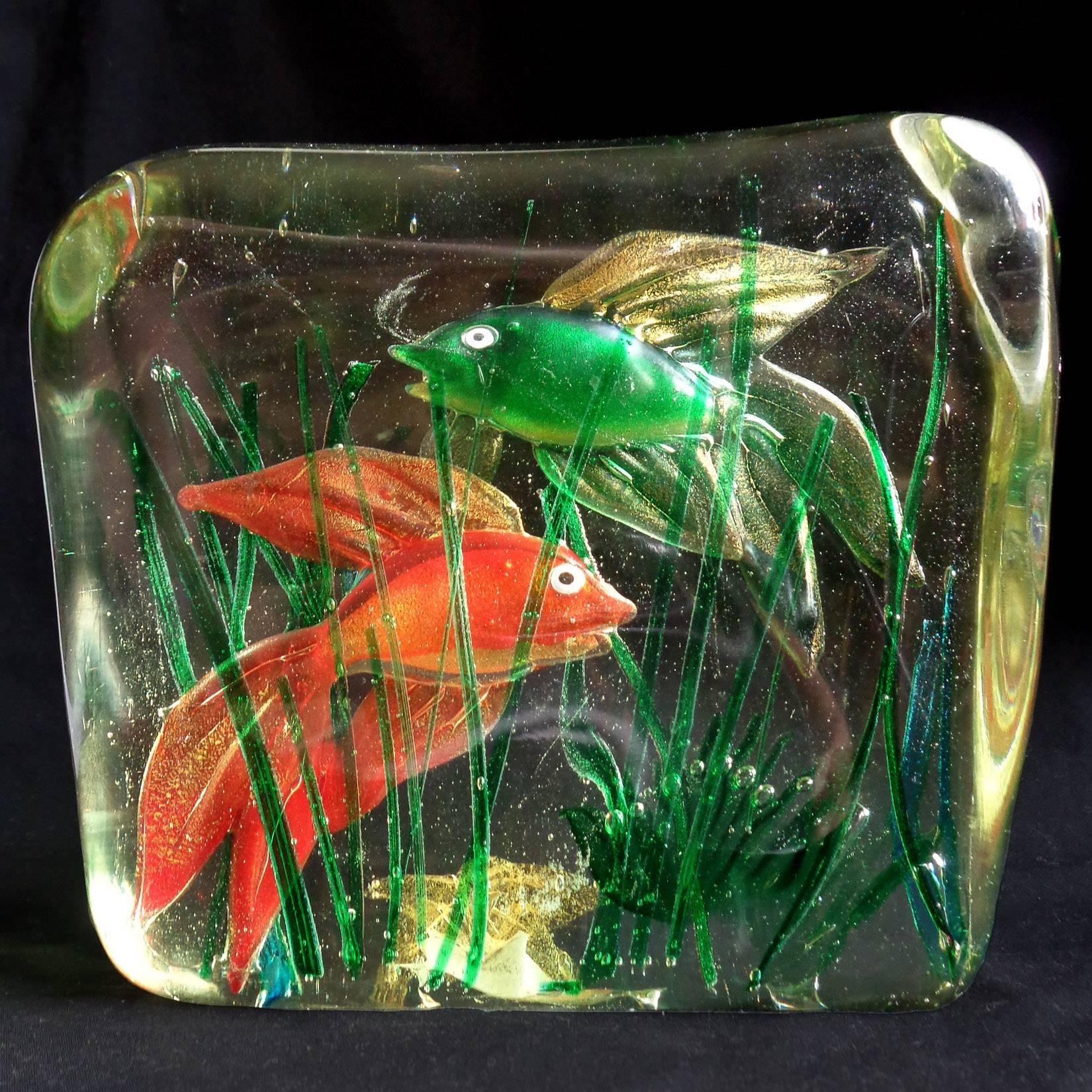 Beautiful large Murano hand blown Italian art glass fancy green and red goldfish aquarium with gold flecks and sea star. Created in the manner of the Alfredo Barbini and the Cenedese Company. The piece is made with three very thick layers of glass.