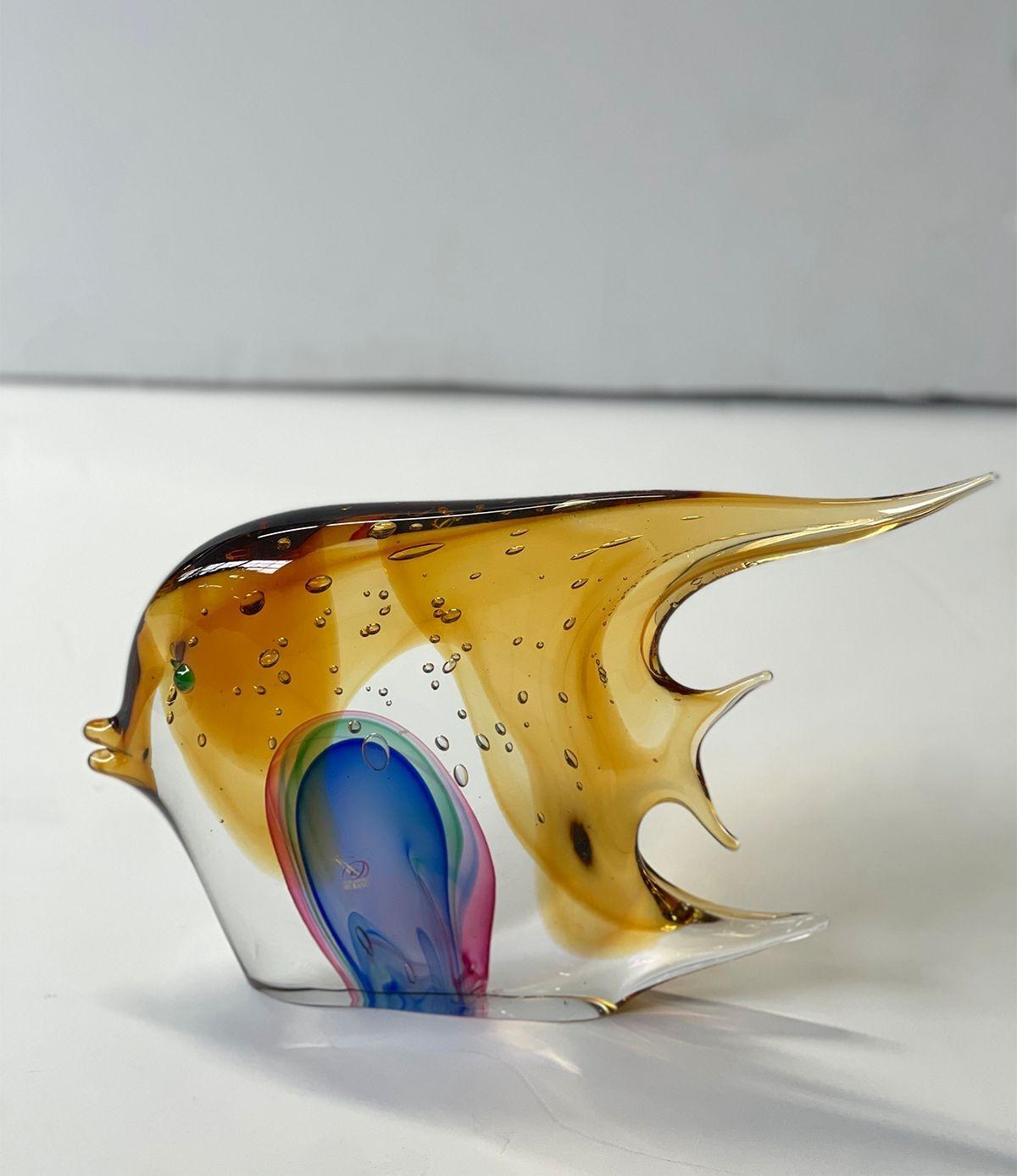 Murano fish sculpture by Sergio Costantini for Vetro Artistico Murano with amber, blue, pink and green Murano glass. Made in Italy, 20th Century (includes sticker and signature).
Dimensions:
10