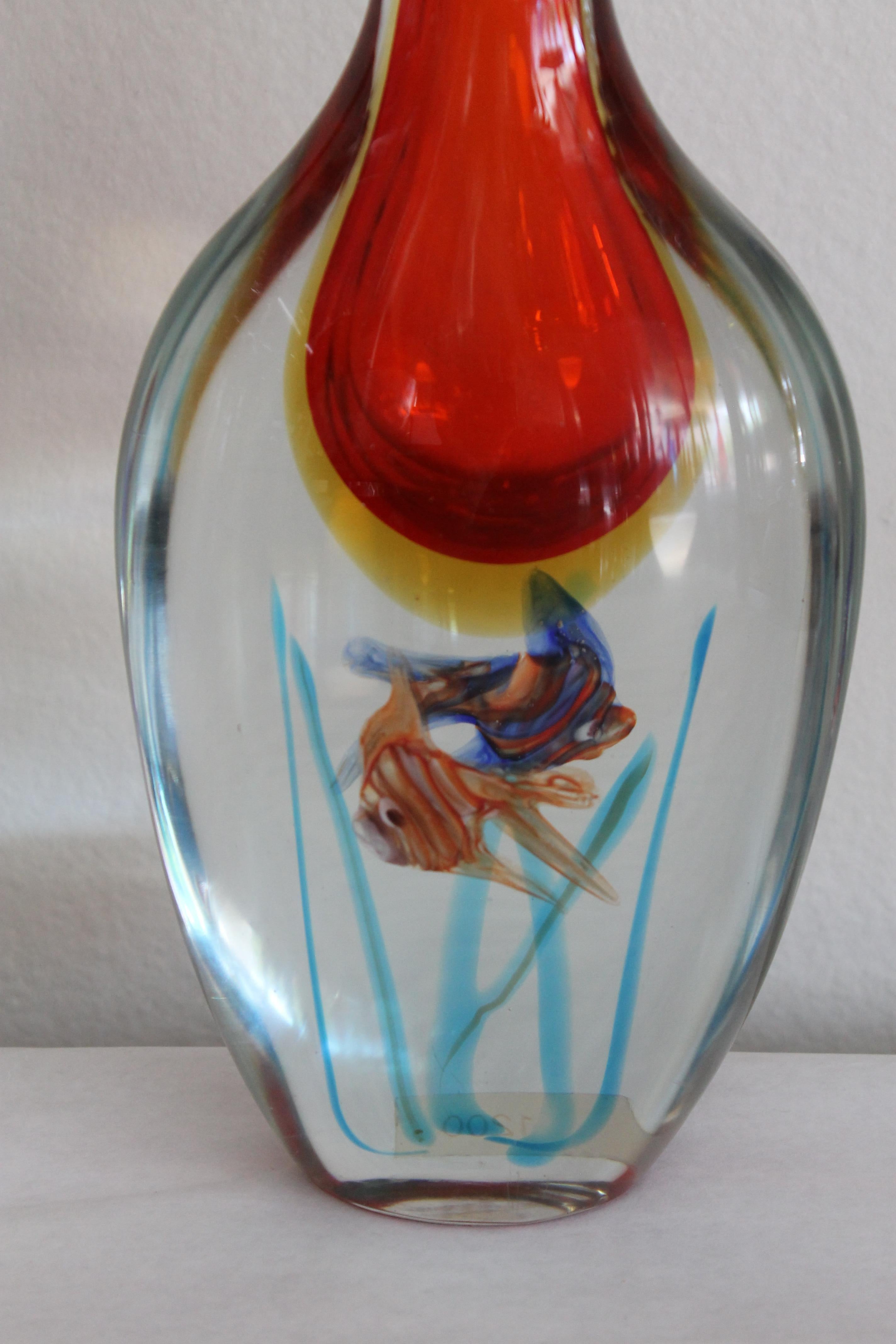 Murano hand blown fish vase infused with color attributed to Barbini.  Vase has a partial Murano label.  Vase measures 6.5