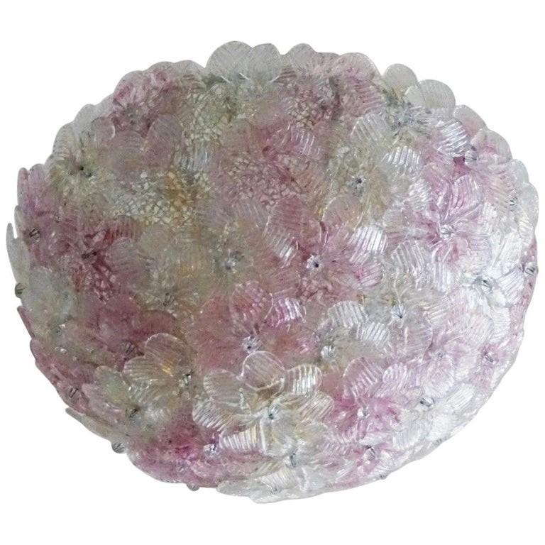 A lovely Barovier & Toso Two-light ceiling basket with overlapping hand blown Murano glass flowers pink and ice with gold inclusion, mounted on a metal webbed white painted frame. This flush mount can also be used as a wall lamp.
It takes two E14