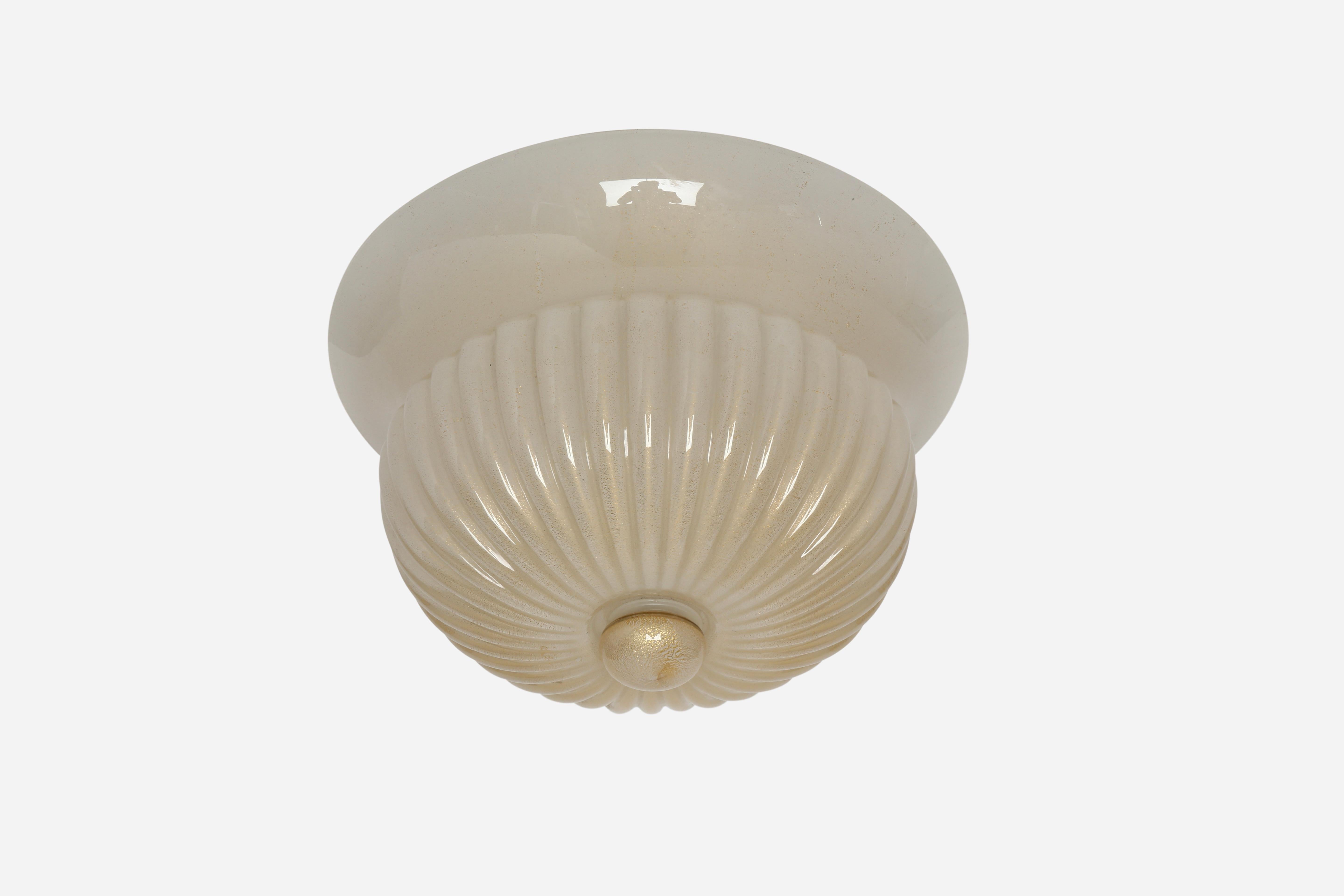 Murano glass flush mount ceiling light by Barovier & Toso.
Designed and made in Italy in 1970s.
Hand blown glass with gold leaf inclusions.
Has original sticker.
Three candelabra bulbs. 
Complimentary US rewiring upon request.