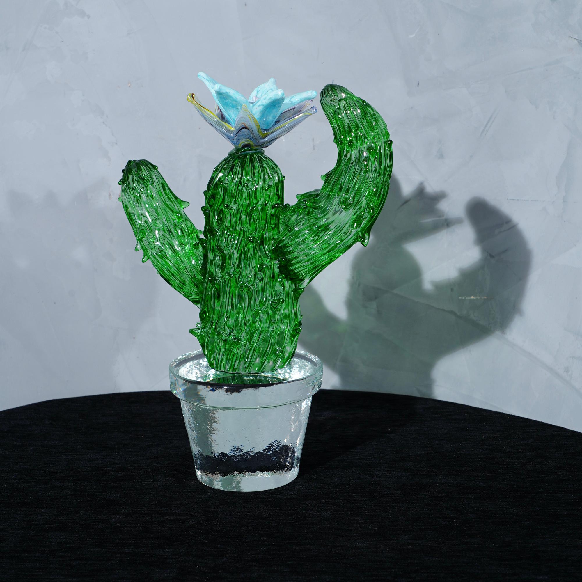 Italian design by Marta Marzotto creator of style, this cactus is a fashion icon of the Italian style, emerald green with a blue and azure colored spot, the flower.

In limited edition, as can be seen from the writing under the transparent vase
