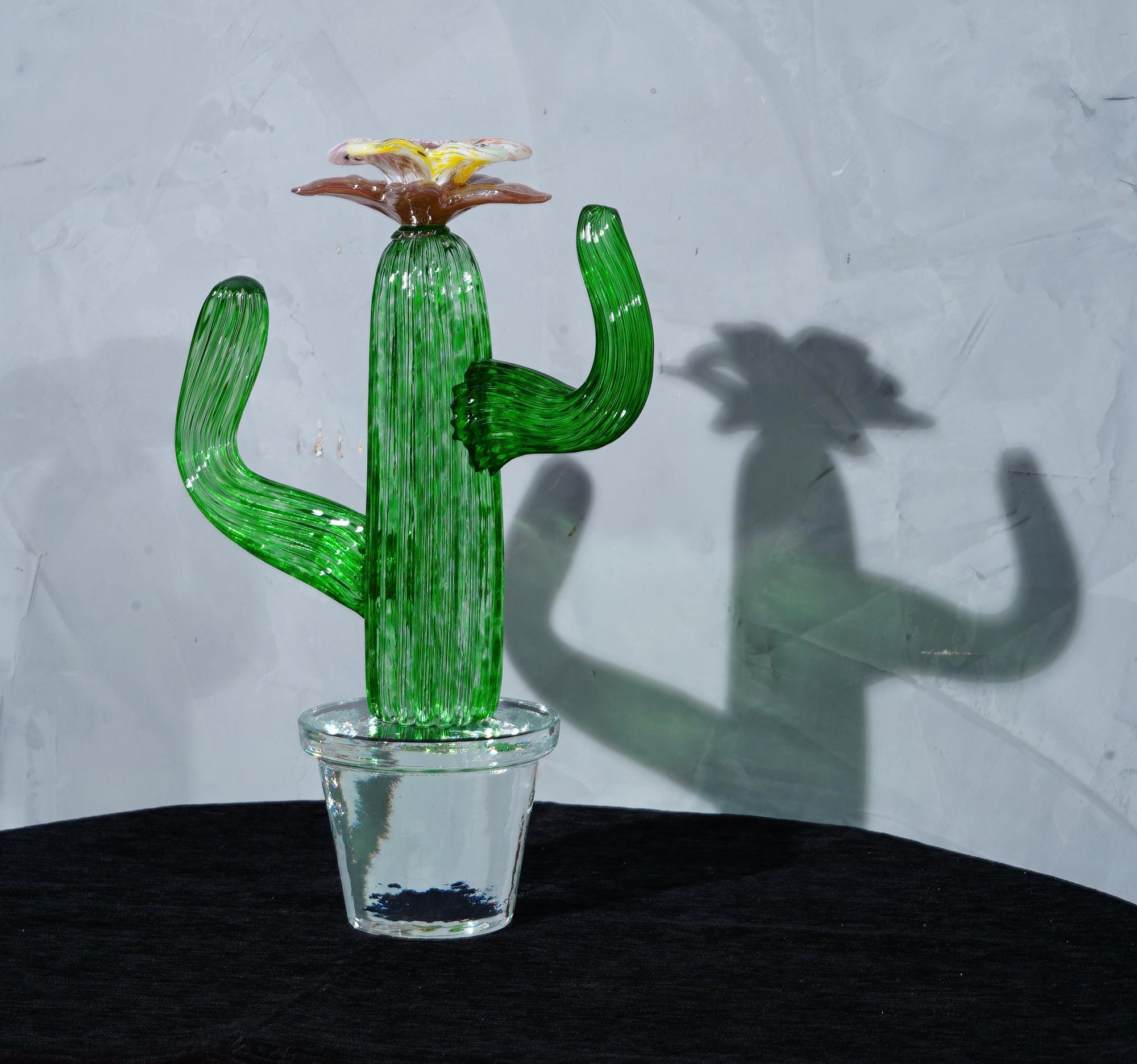 Italian design by Marta Marzotto creator of style, this cactus is a fashion icon of the Italian style, emerald green with a red and yellow colored spot, the flower.

In limited edition, as can be seen from the writing under the transparent vase